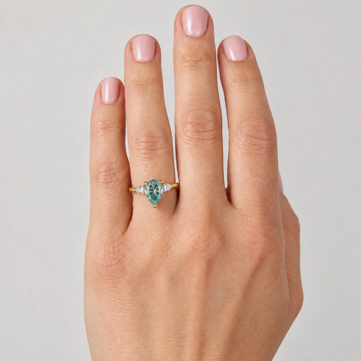 Platinum or 18ct Gold Bespoke Turquoise Moissanite Ring – 2.00ct Pear-Shaped Centre with Lab-Grown Pear Diamond Shoulders. Handmade in London by Daniel Greenberg