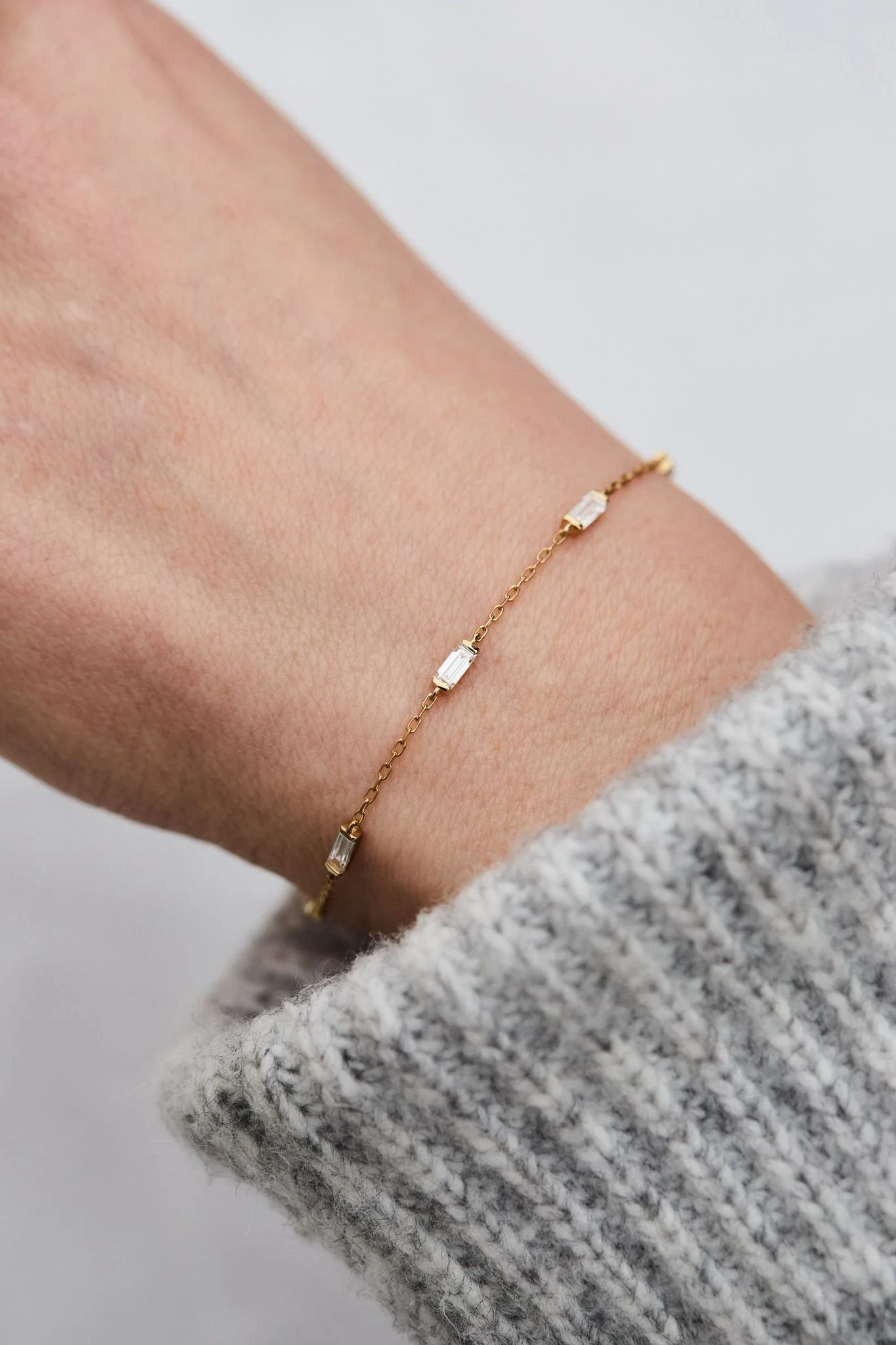 Baguette cut lab grown diamonds ‘end set’ in 18ct gold.