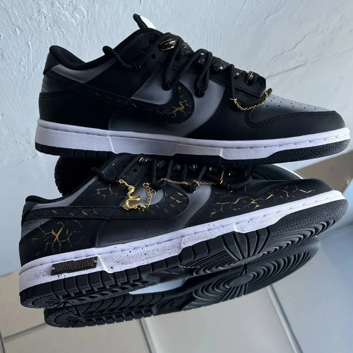 Nike Dunk Low Dragon Vein Custom black and gold sneaker with gold chain and dragon charm.jpeg