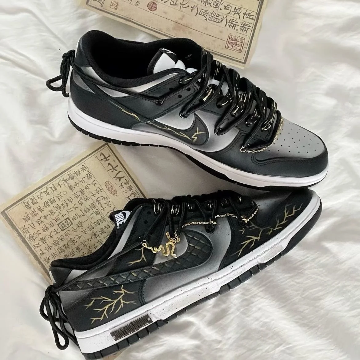 Nike Dunk Low Dragon Vein Custom black and gold sneaker with gold chain and dragon charm.jpeg