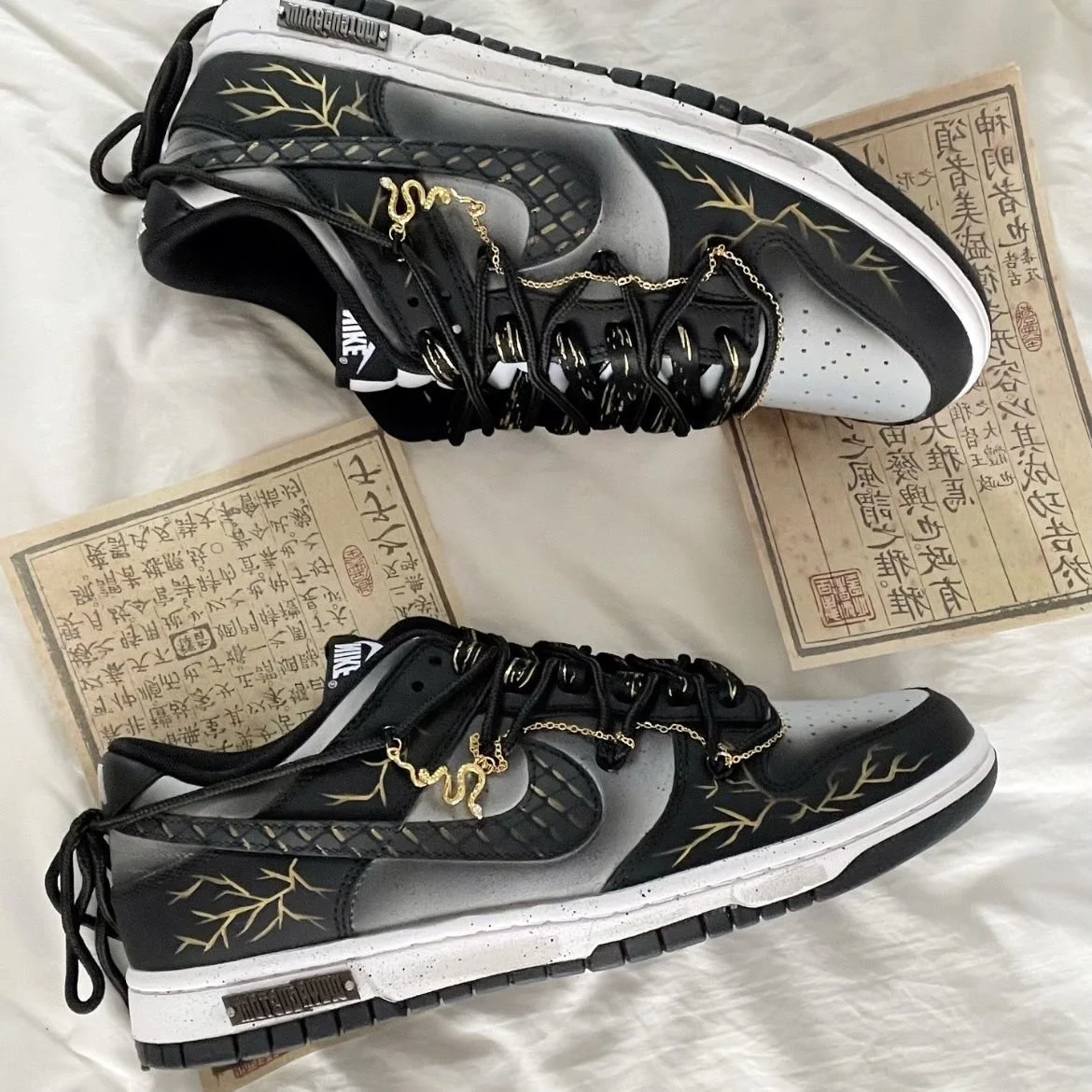 Nike Dunk Low Dragon Vein Custom black and gold sneaker with gold chain and dragon charm.jpeg