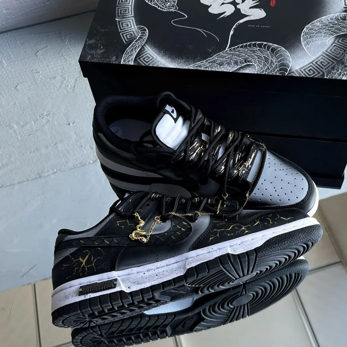 Nike Dunk Low Dragon Vein Custom black and gold sneaker with gold chain and dragon charm.jpeg
