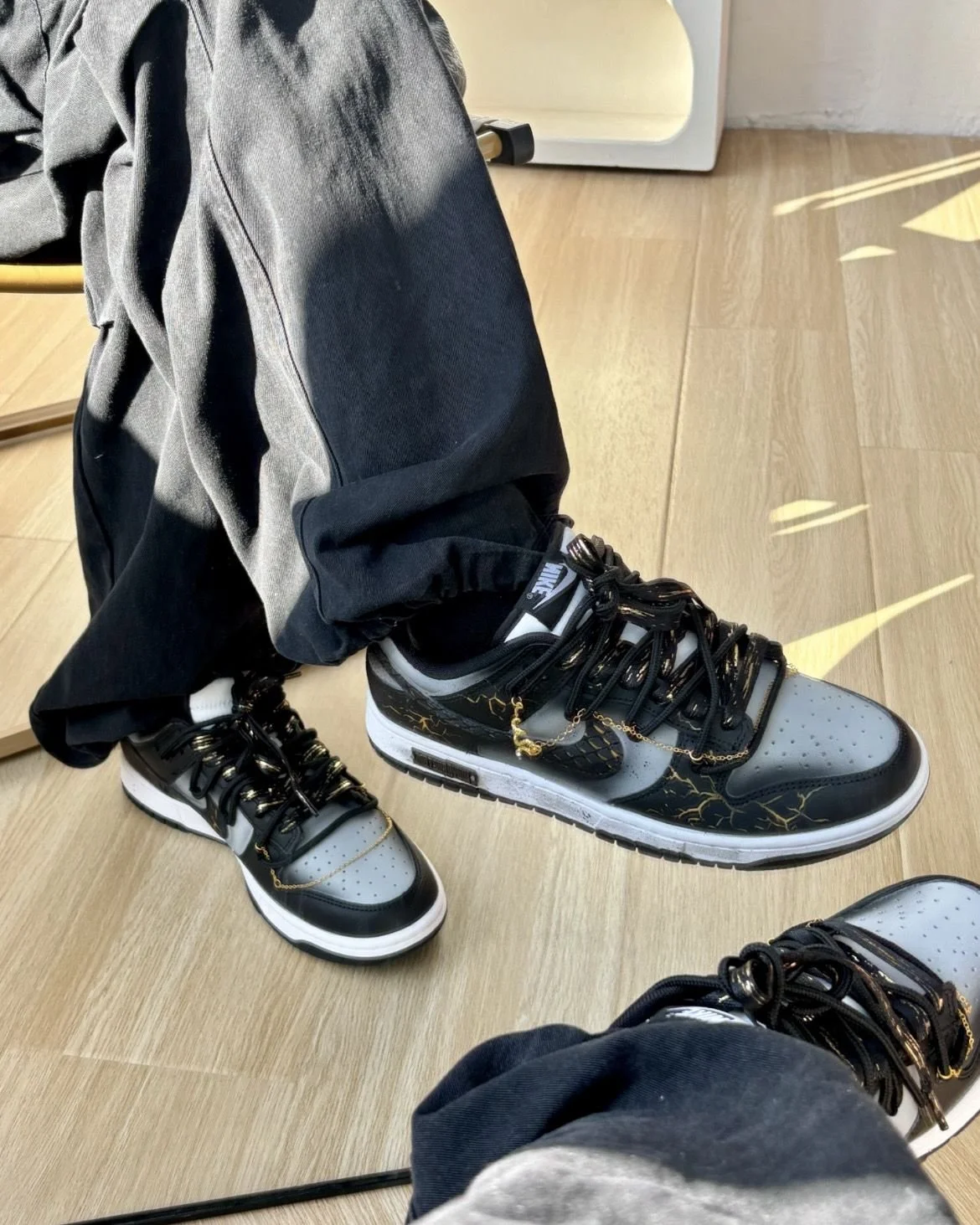 Nike Dunk Low Dragon Vein Custom black and gold sneaker with gold chain and dragon charm.jpeg