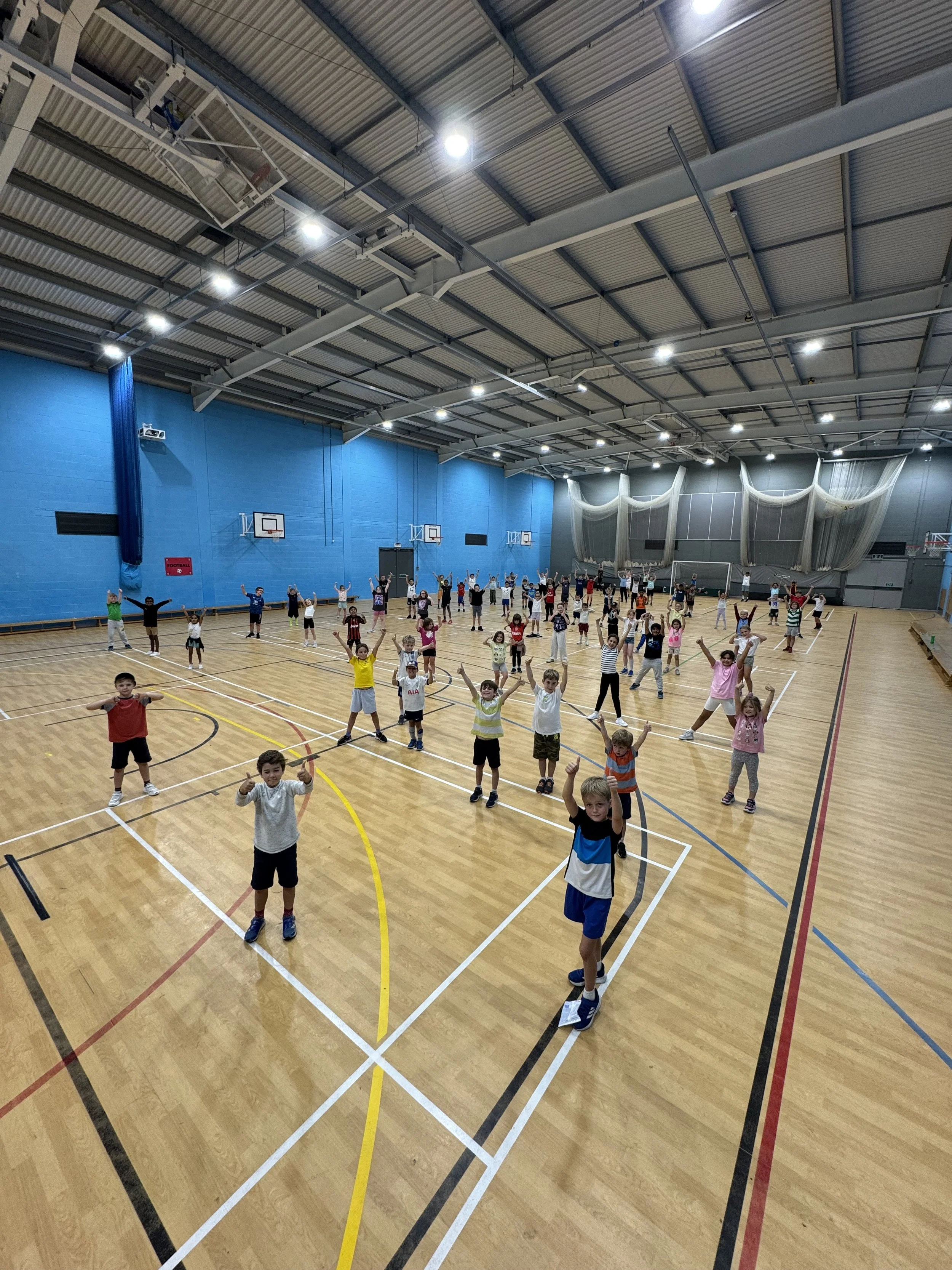 Children enjoying indoor sports activities at First Touch Sports MegaCamp holiday club in Amersham
