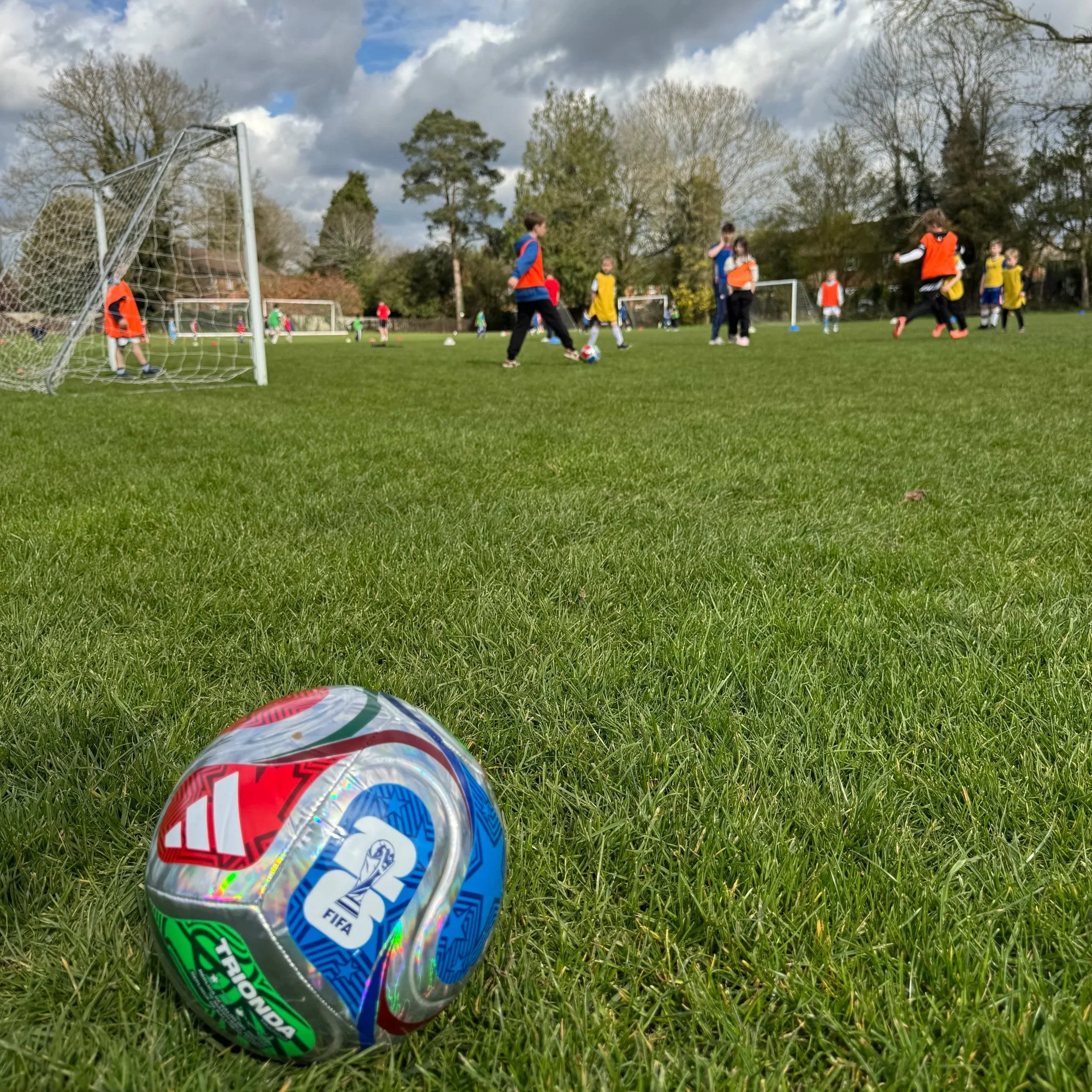 Young boy playing football at First Touch Sports MegaCamp holiday club for kids aged 5–12 in Buckinghamshire