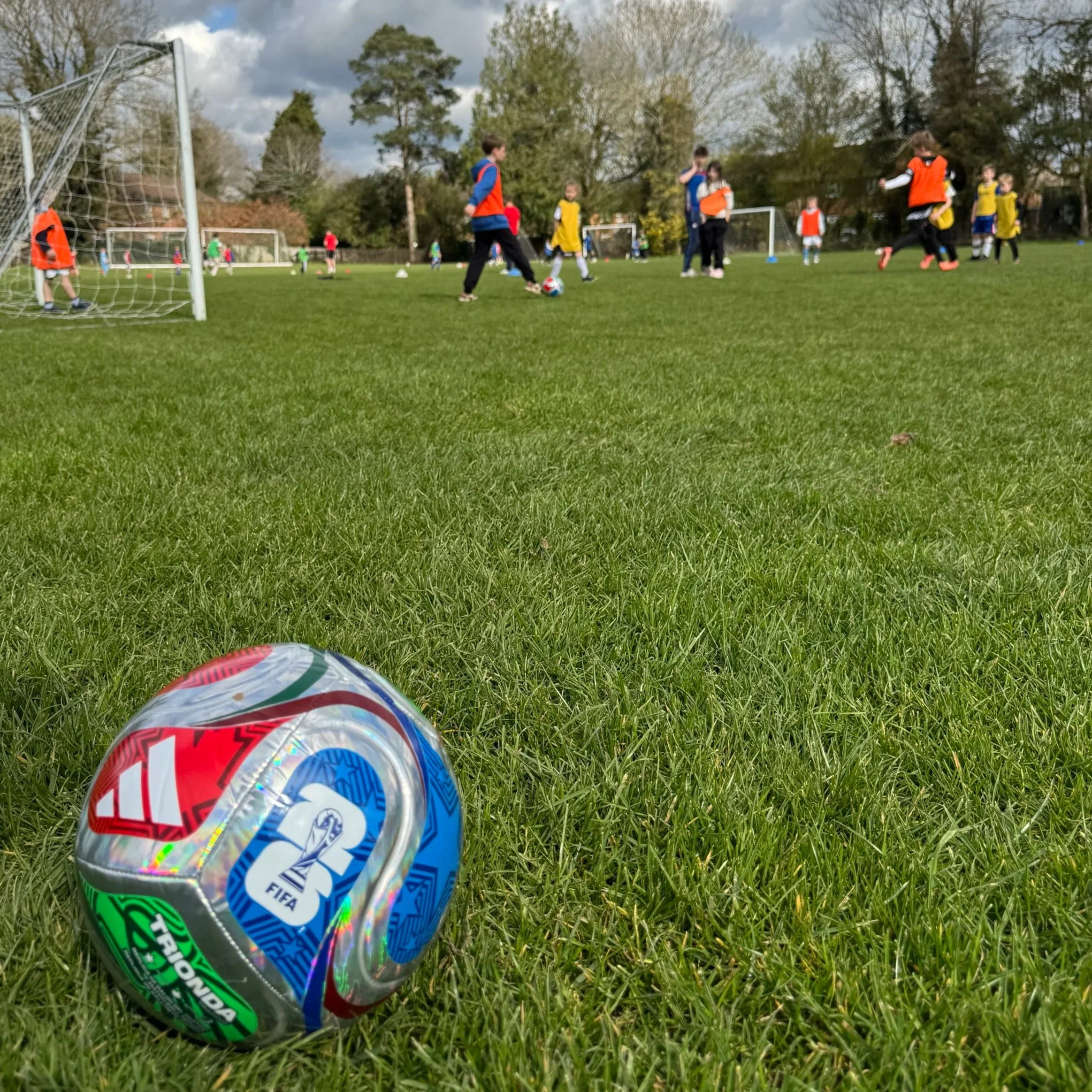 Young boy playing football at First Touch Sports MegaCamp holiday club for kids aged 5–12 in Buckinghamshire