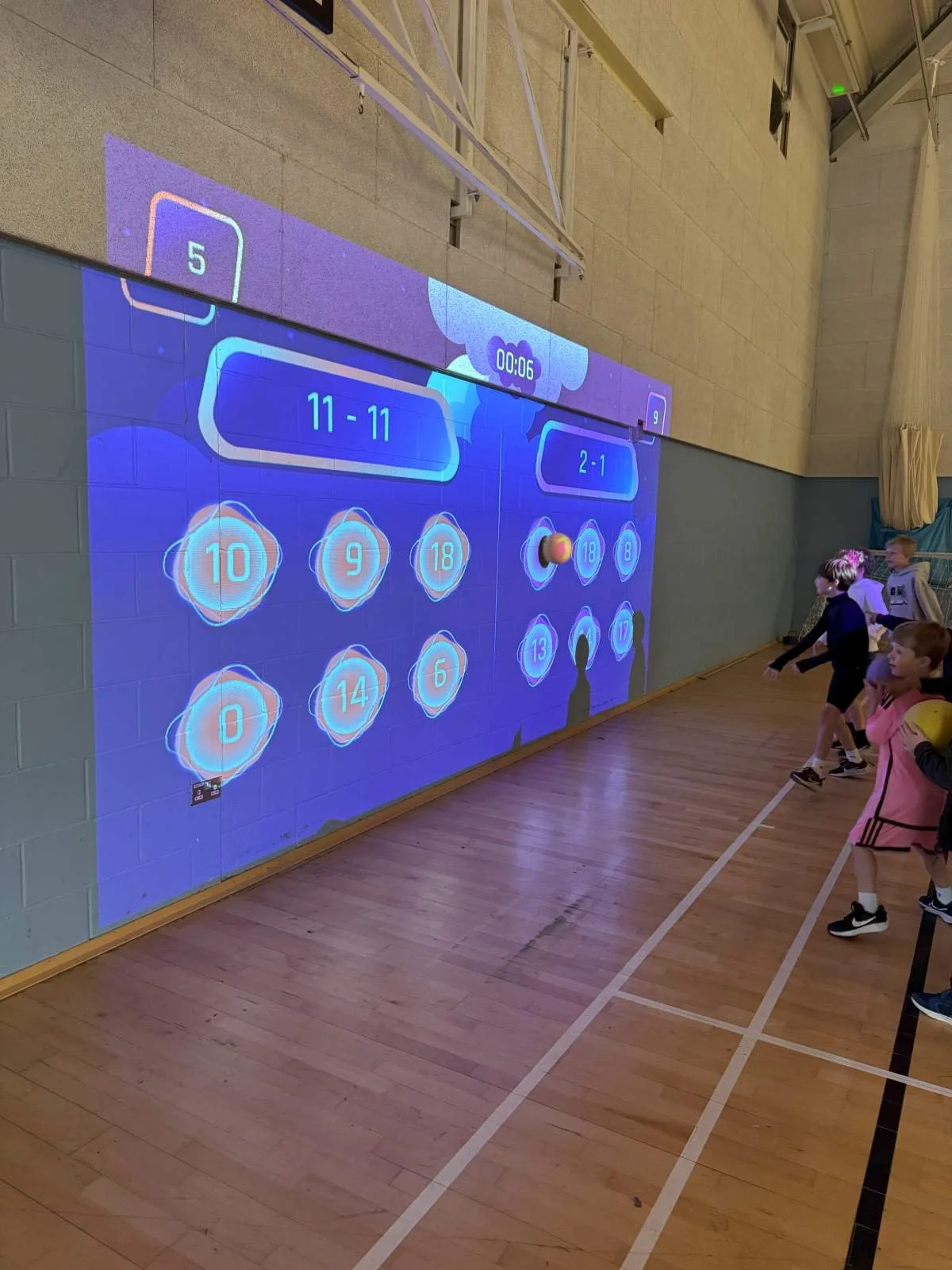 Children playing reaction-based games using the Interactive Sports Wall at a First Touch Sports birthday party in Buckinghamshire