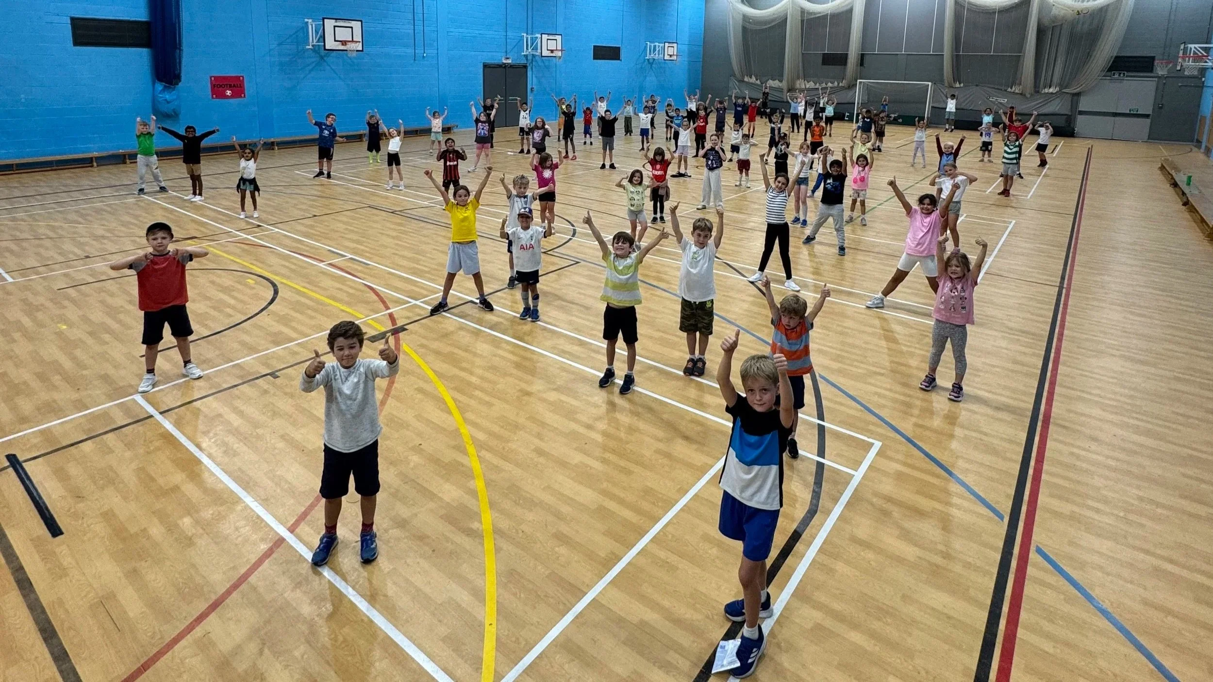 Children gathered in hall ready to start First Touch Sports MegaCamp holiday activities in Amersham