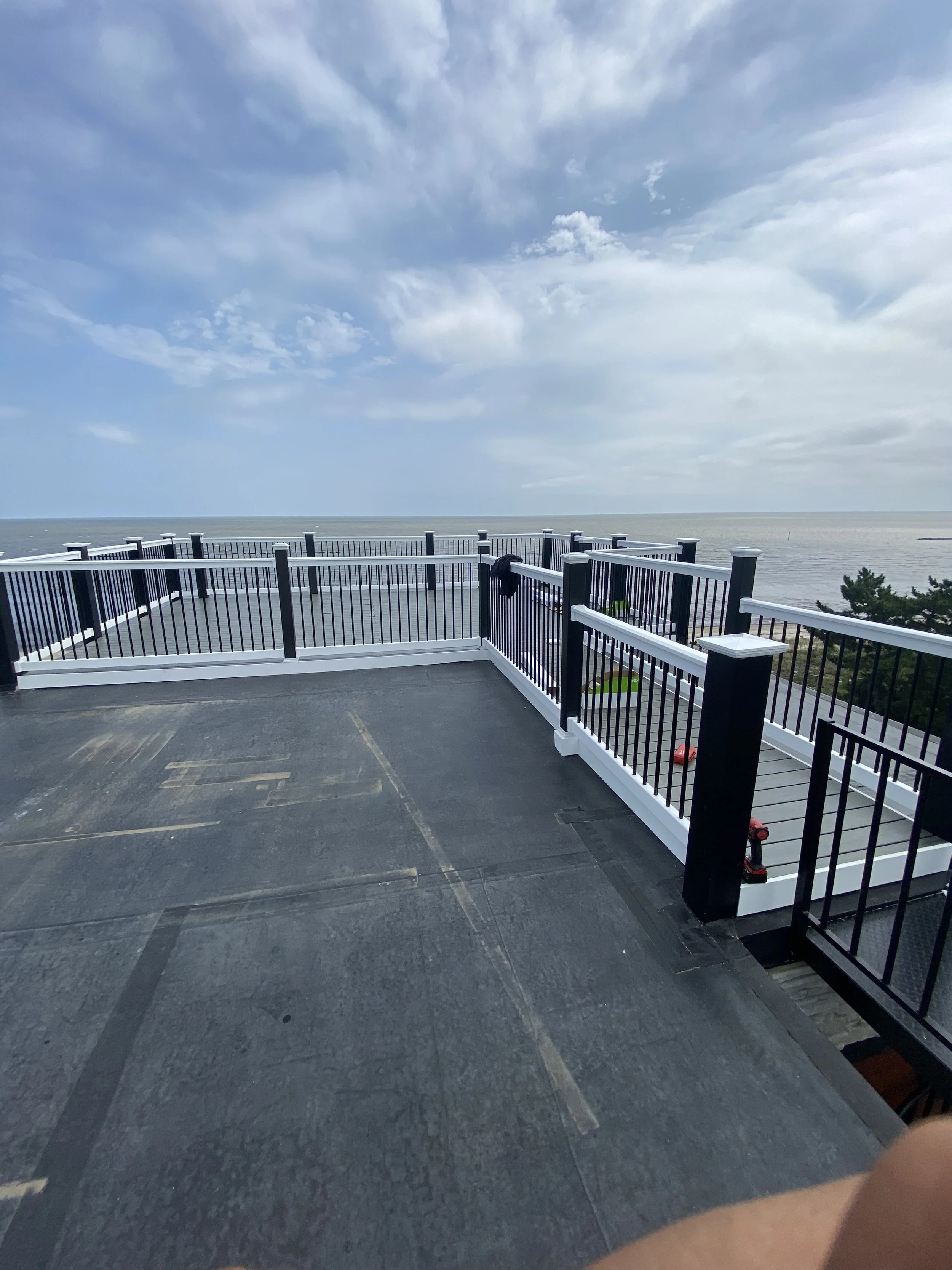 Exterior deck and railing carpentry work in Rehoboth Beach, DE by Reyes Renovation