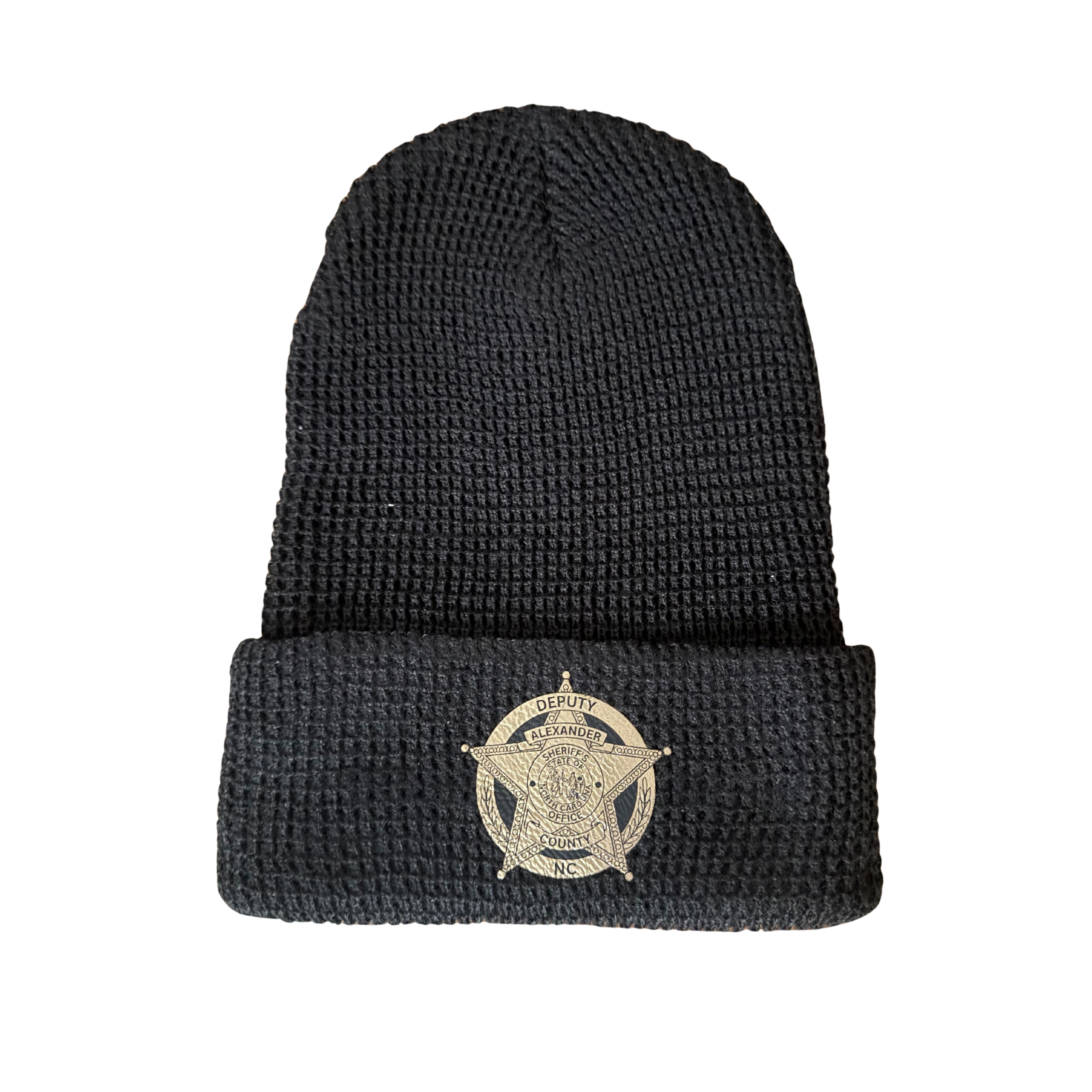 Black knit police hat with a sheriff's badge on the front.