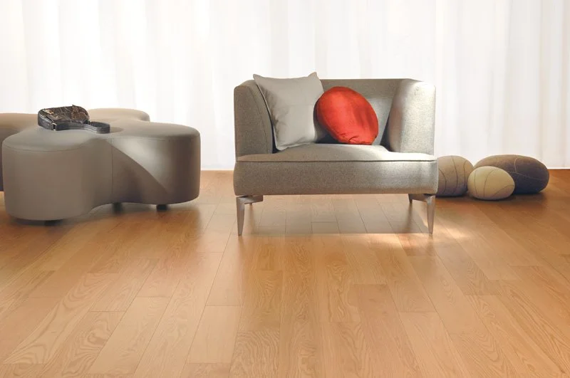 Natural red oak hardwood flooring installed in a finished room