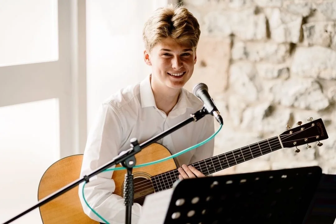 Oscar Flanagan preparing to play a couple down the aisle at a wedding