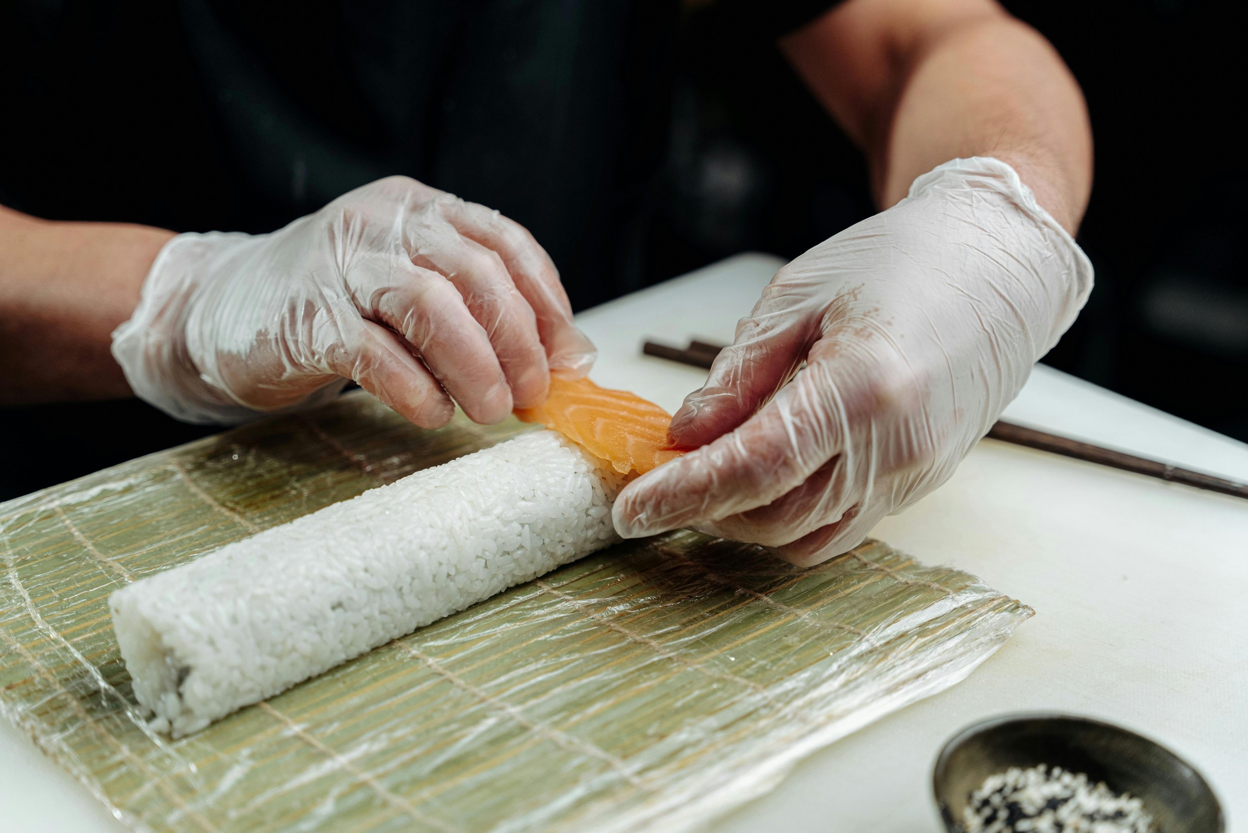 Sushi Chef preparing fresh sushi in premium Japanese restaurant in London