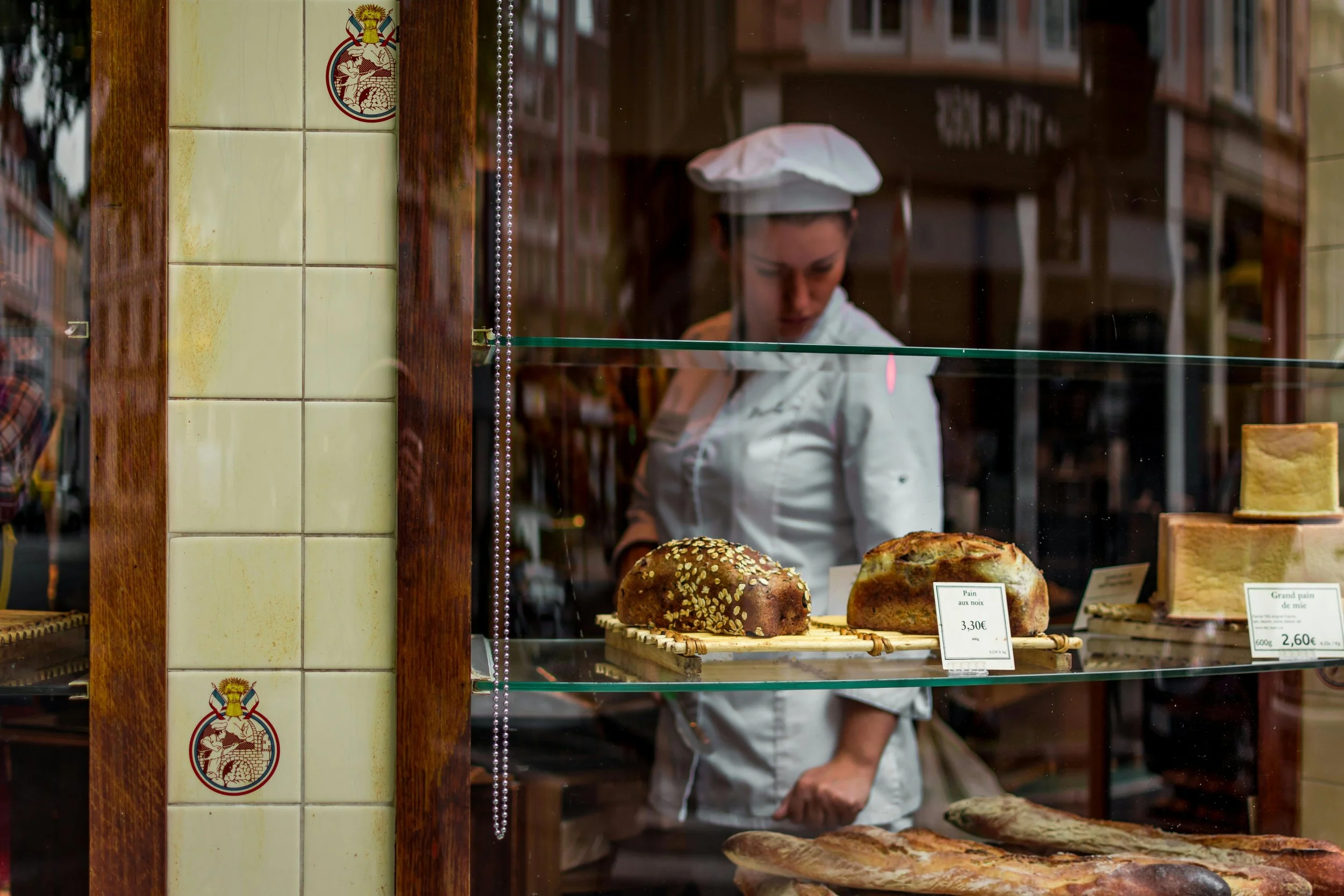 Pastry Chef plating fine dining dessert in London restaurant kitchen