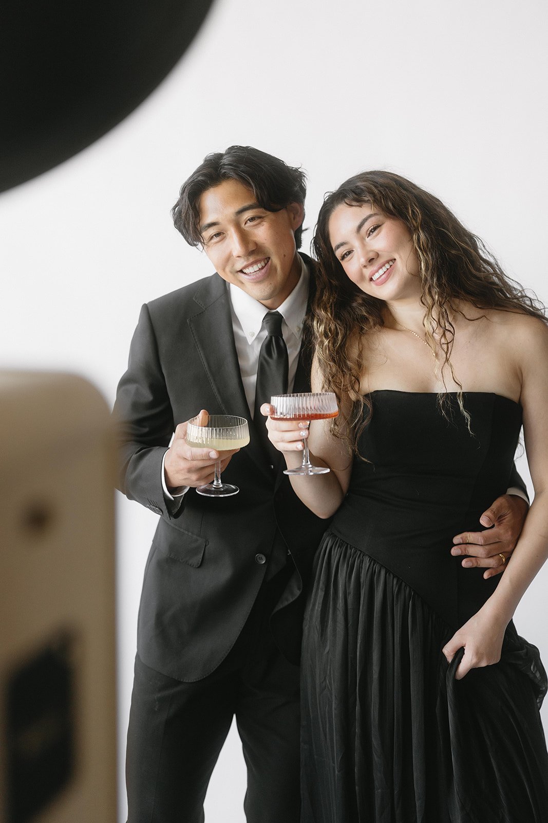 Guests enjoying a luxury photo booth experience at an upscale wedding celebration.