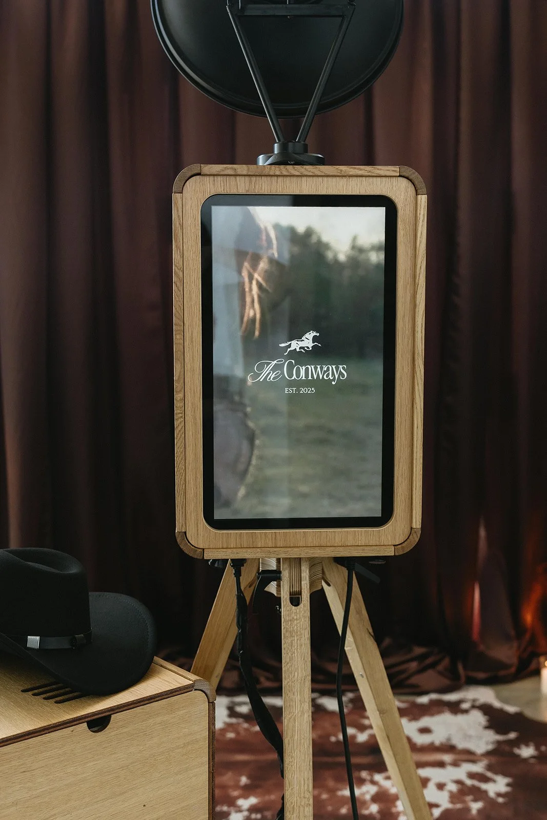 Custom digital display featured on a luxury photo booth rental, showcasing personalized event branding.
