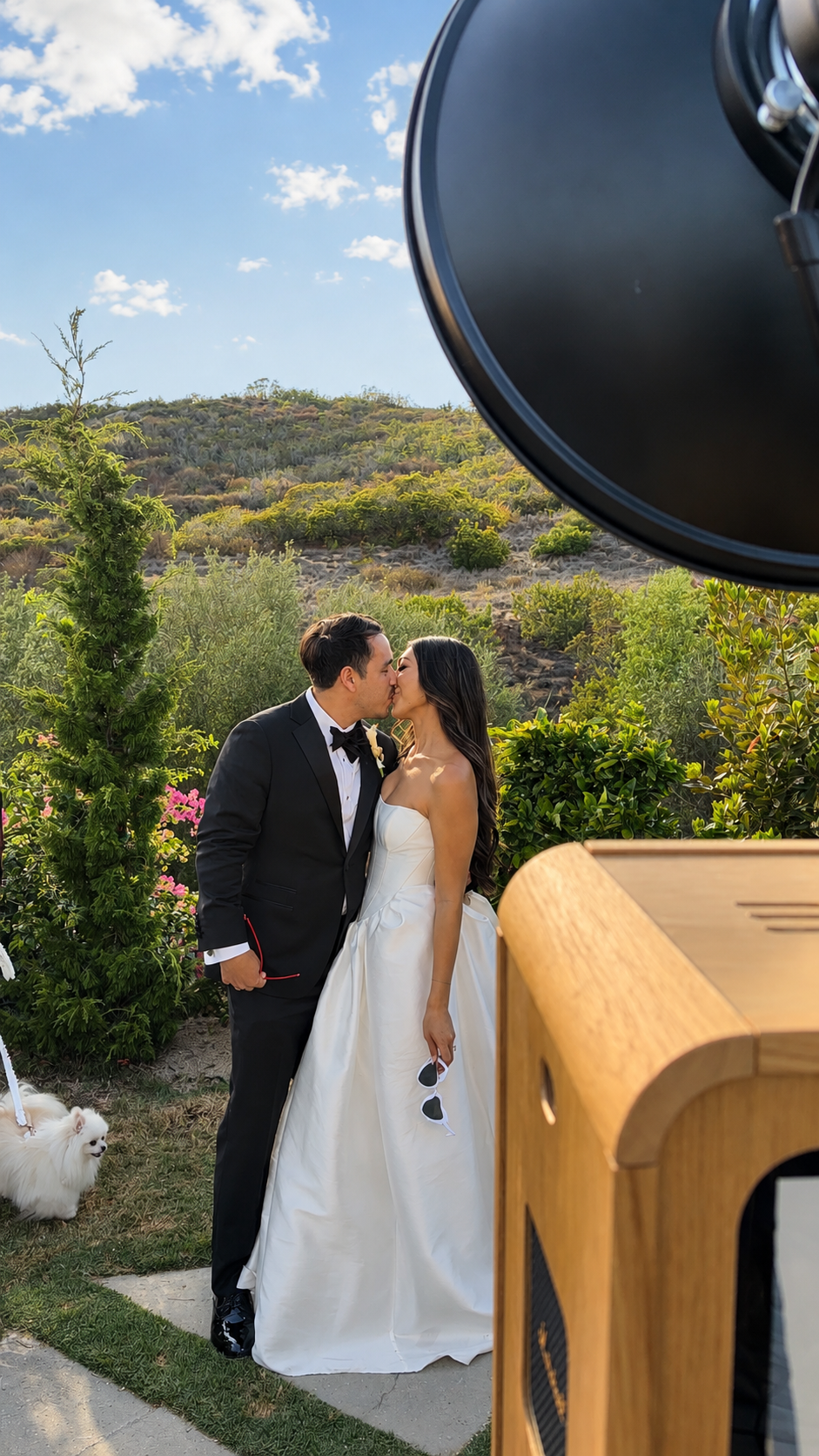 Bride and groom using a luxury wedding photo booth with scenic outdoor views at a Southern California wedding.