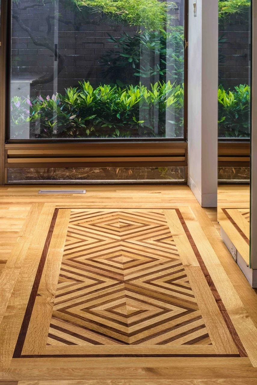  custom quartered white oak and walnut hardwood floor in a geometric pattern by Connor Design-Build 
