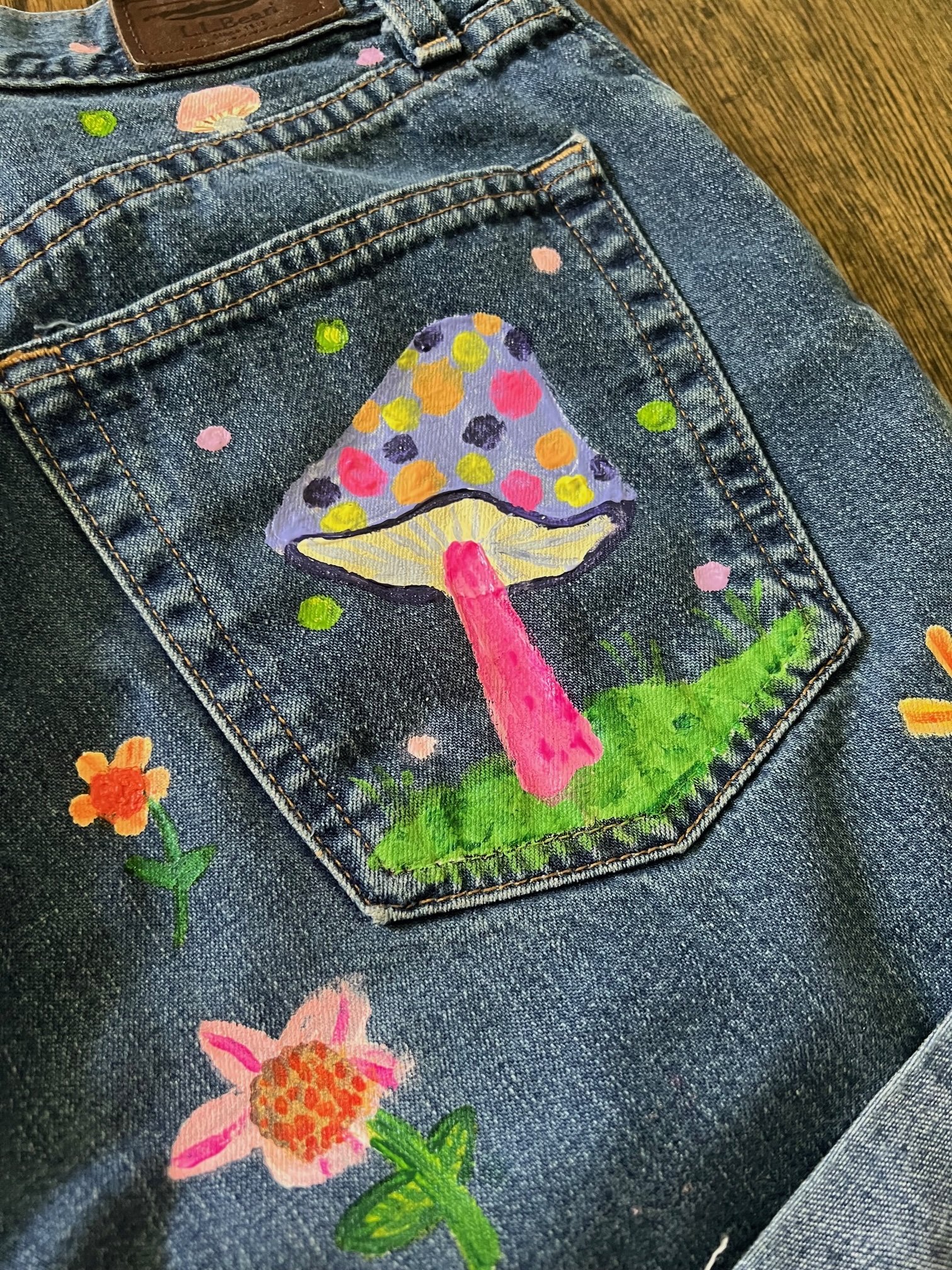 Upcycled, handpainted denim blue jean shorts by artist Kaylor Otwell.