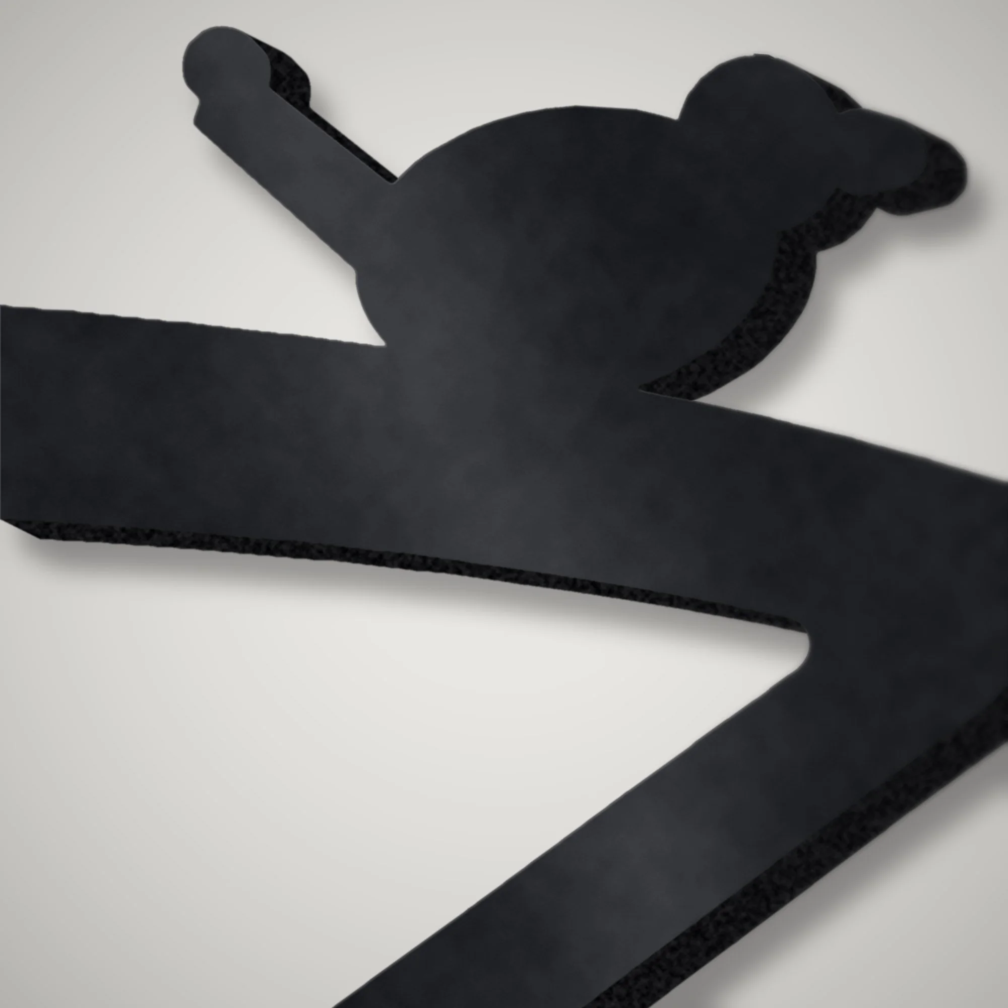 Close-up of the wren silhouette plasma-cut in 5 mm steel showing the thick cut edge