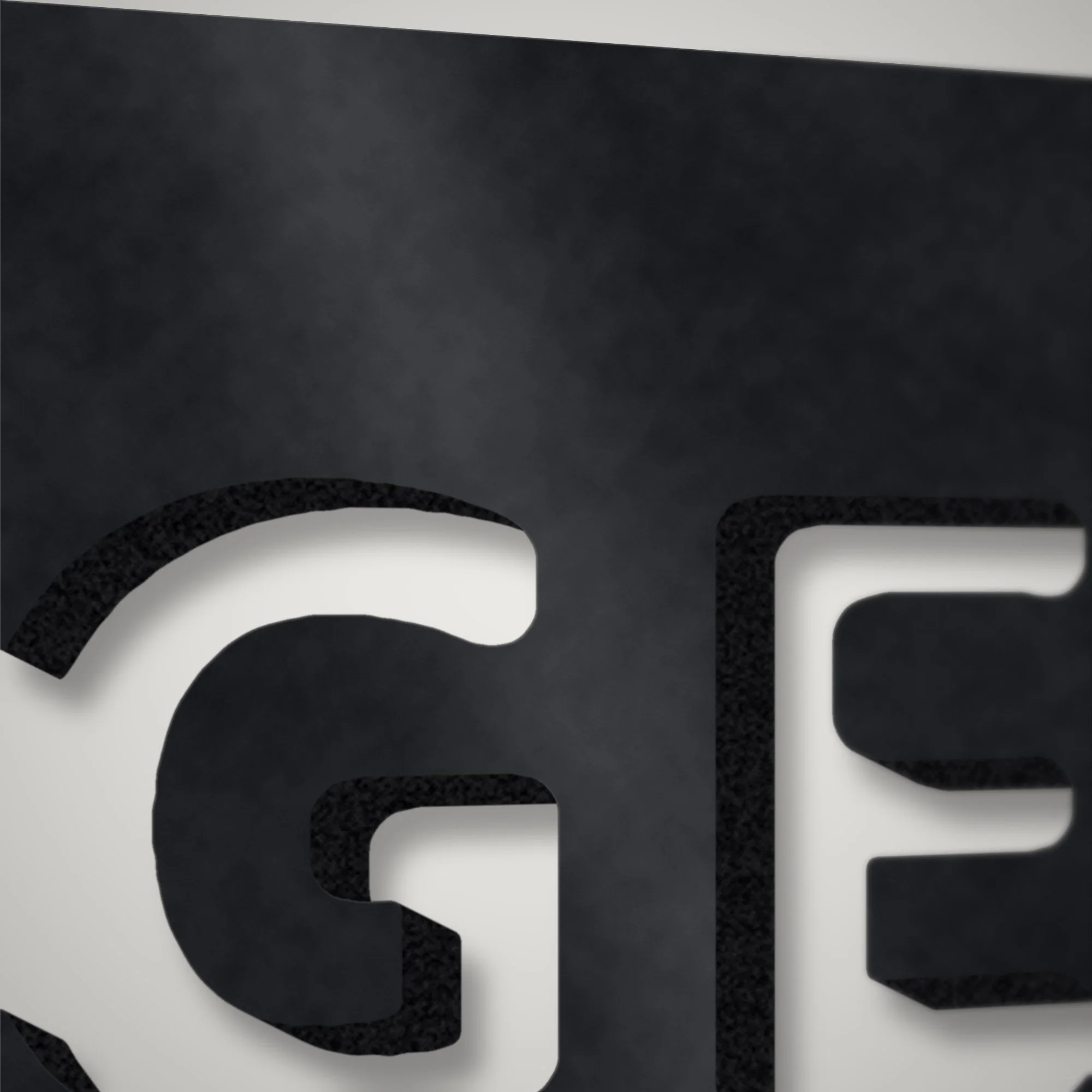 Close-up of plasma-cut stencil lettering on the name plate showing the clean cut edge of 3 mm mild steel