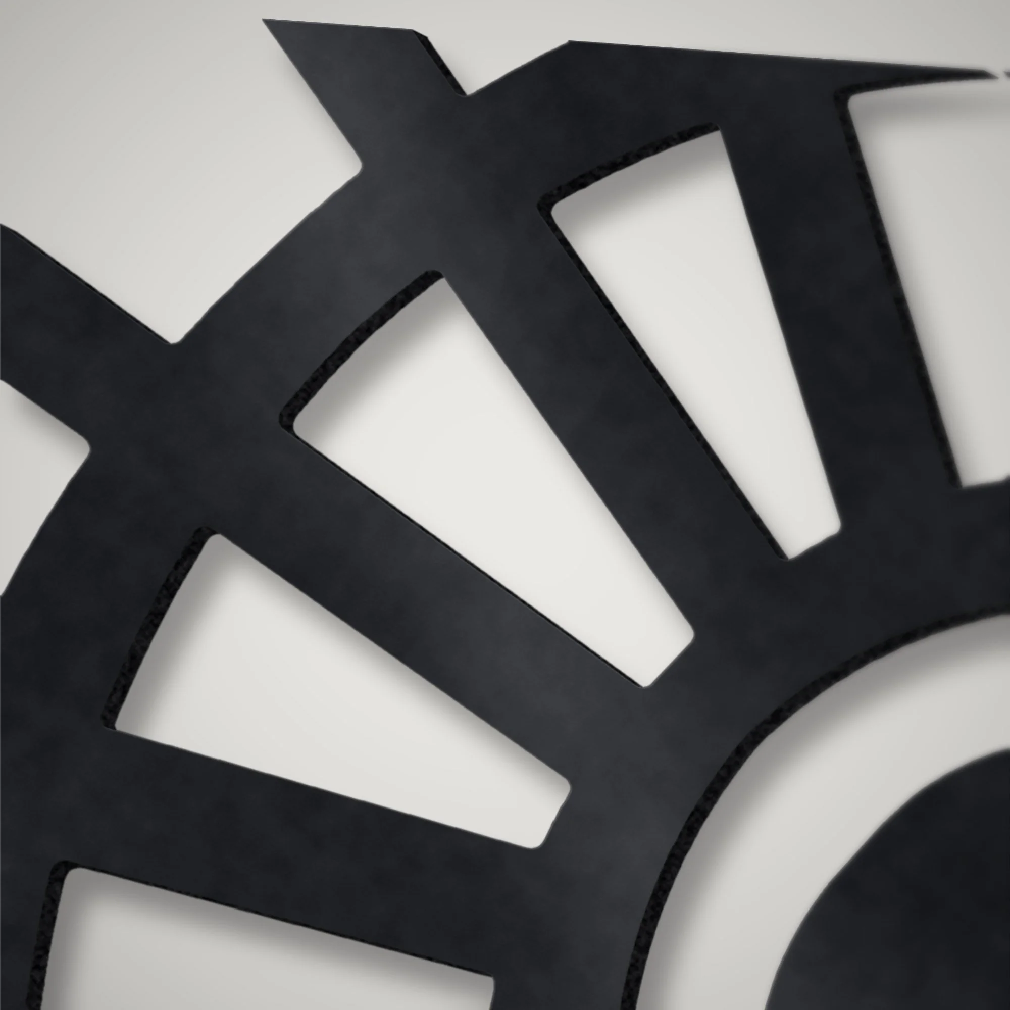 Close-up of the plasma-cut sunburst fan edges on the 3 mm steel fireplace screen