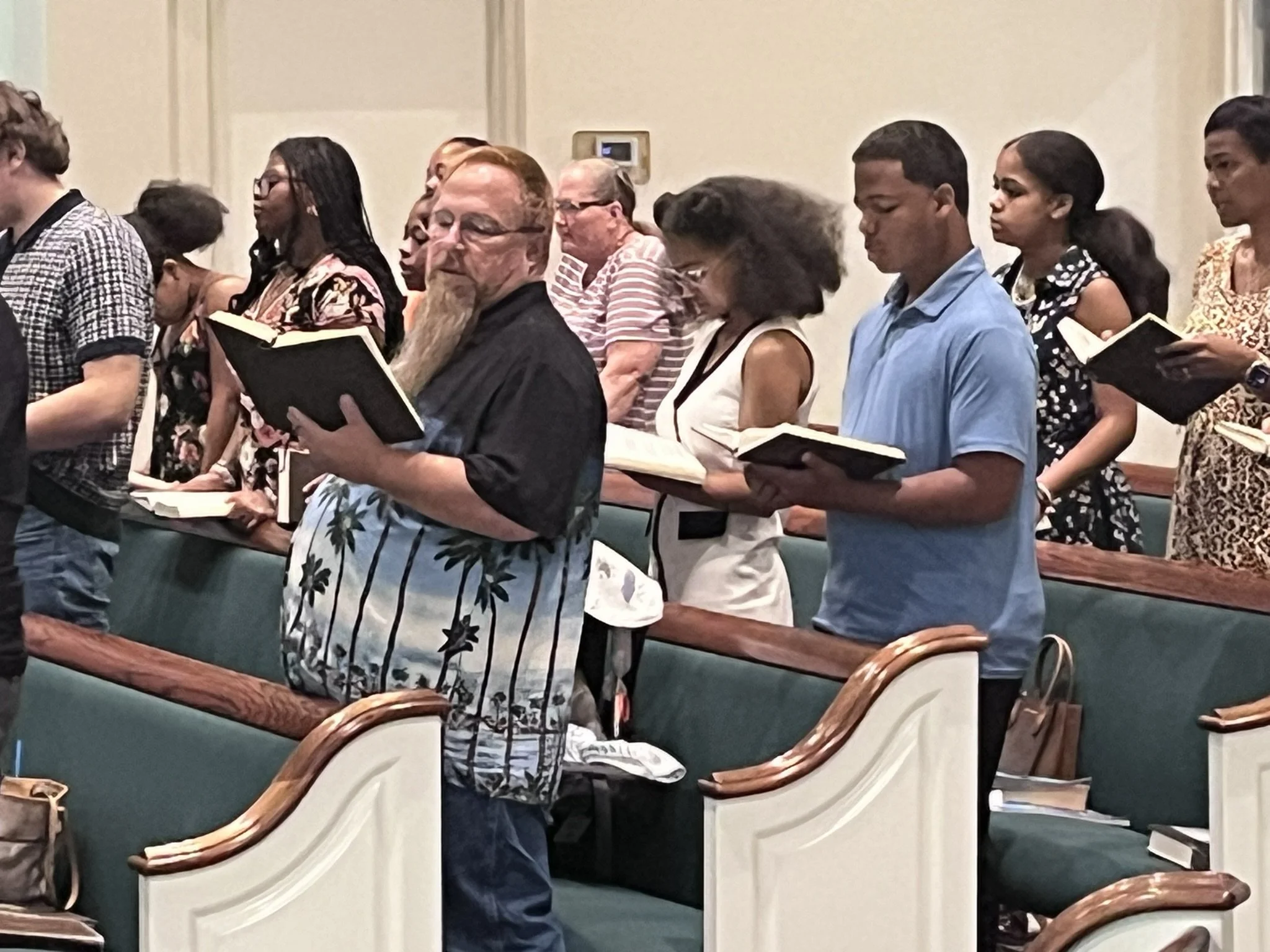 Members of Powell Road Church of Christ singing together during worship