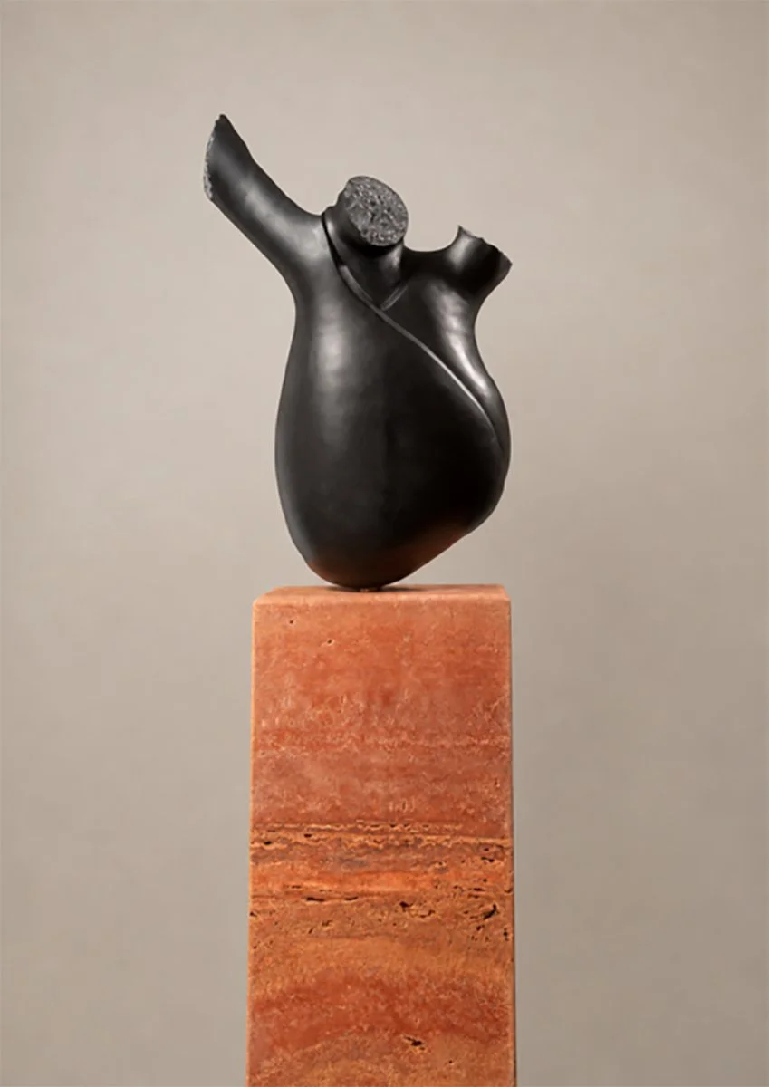 'Bolgán' .
Belgian black marble on Iranian travertine base .
Height - 140cm .
Width - 50cm .
Depth - 40cm .
POA