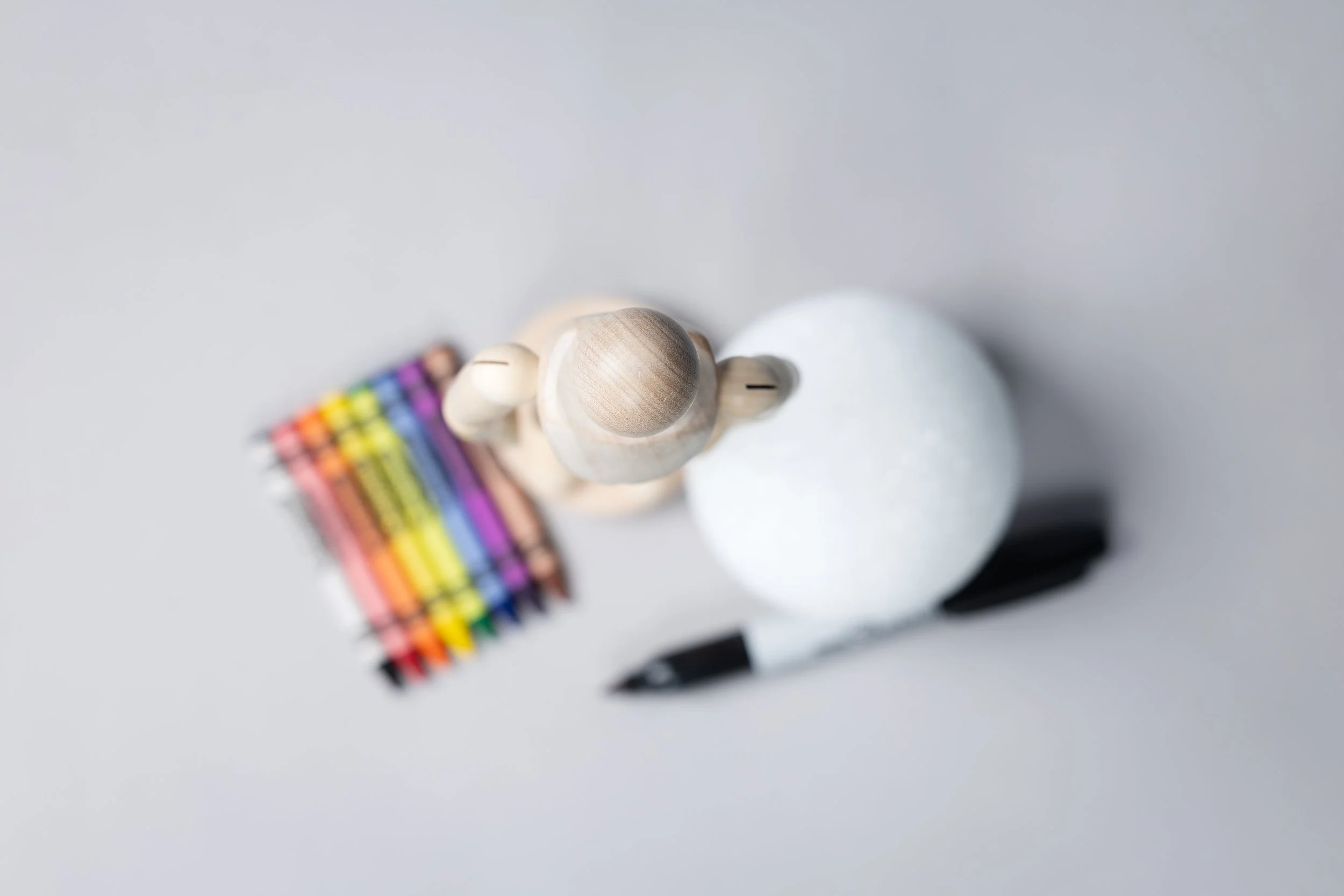 CPP Technical Image Evaluation submission wooden manikin styrofoam ball Crayola crayons Sharpie gray paper overhead view