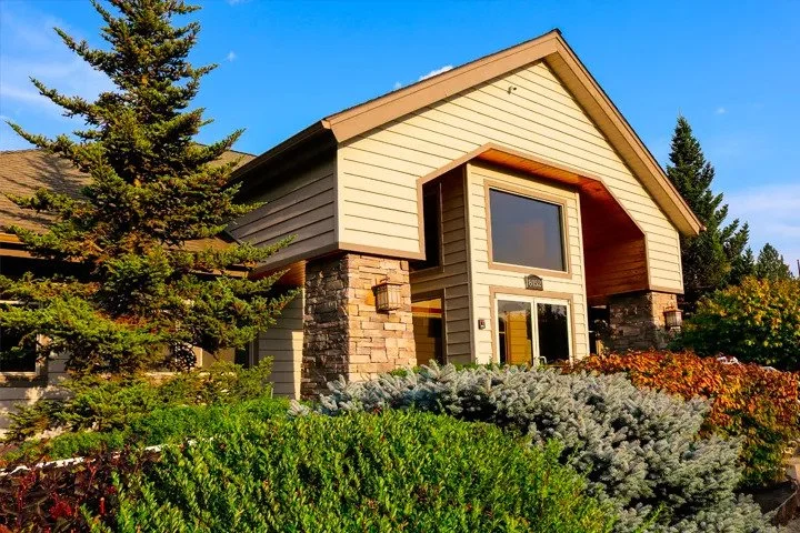 Exterior of the Summit Health and Wellness office in Hayden, a wood and stone building with evergreen trees