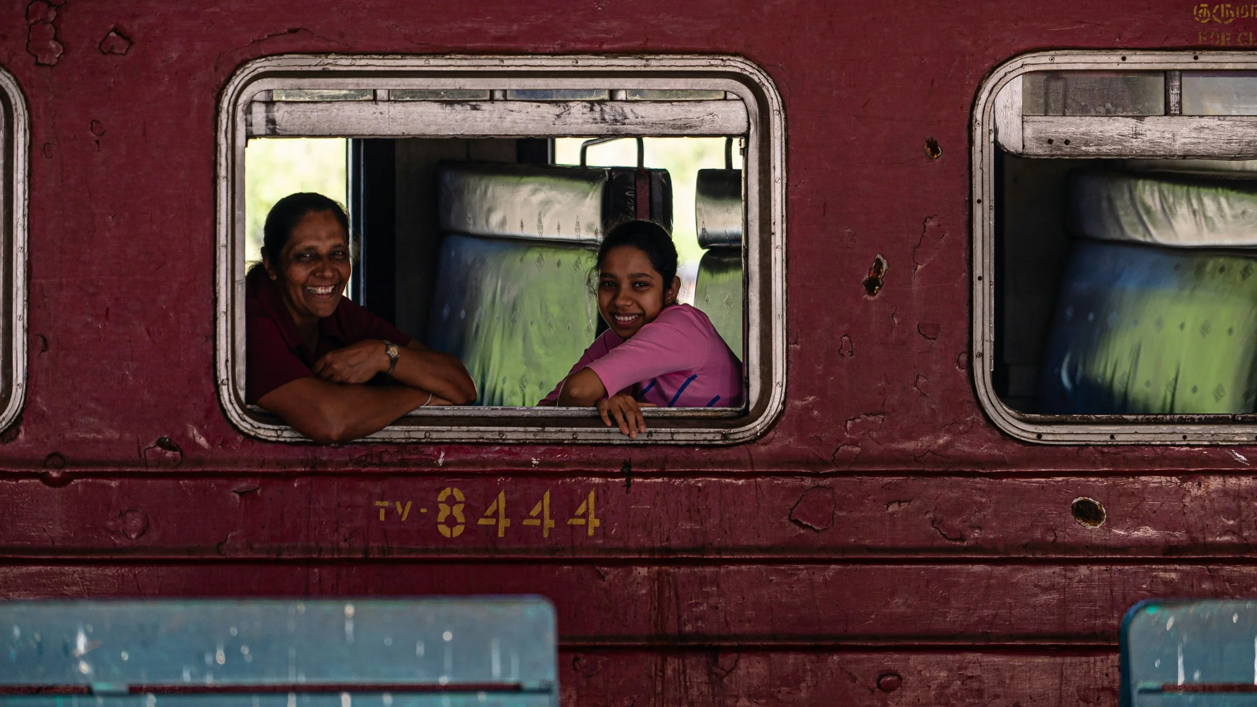 smiling women on a train in Sri Lanka
