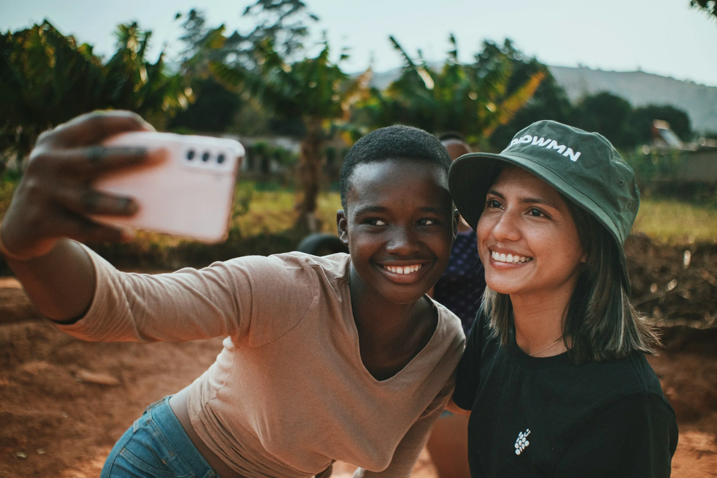 two young women smiling at a camera