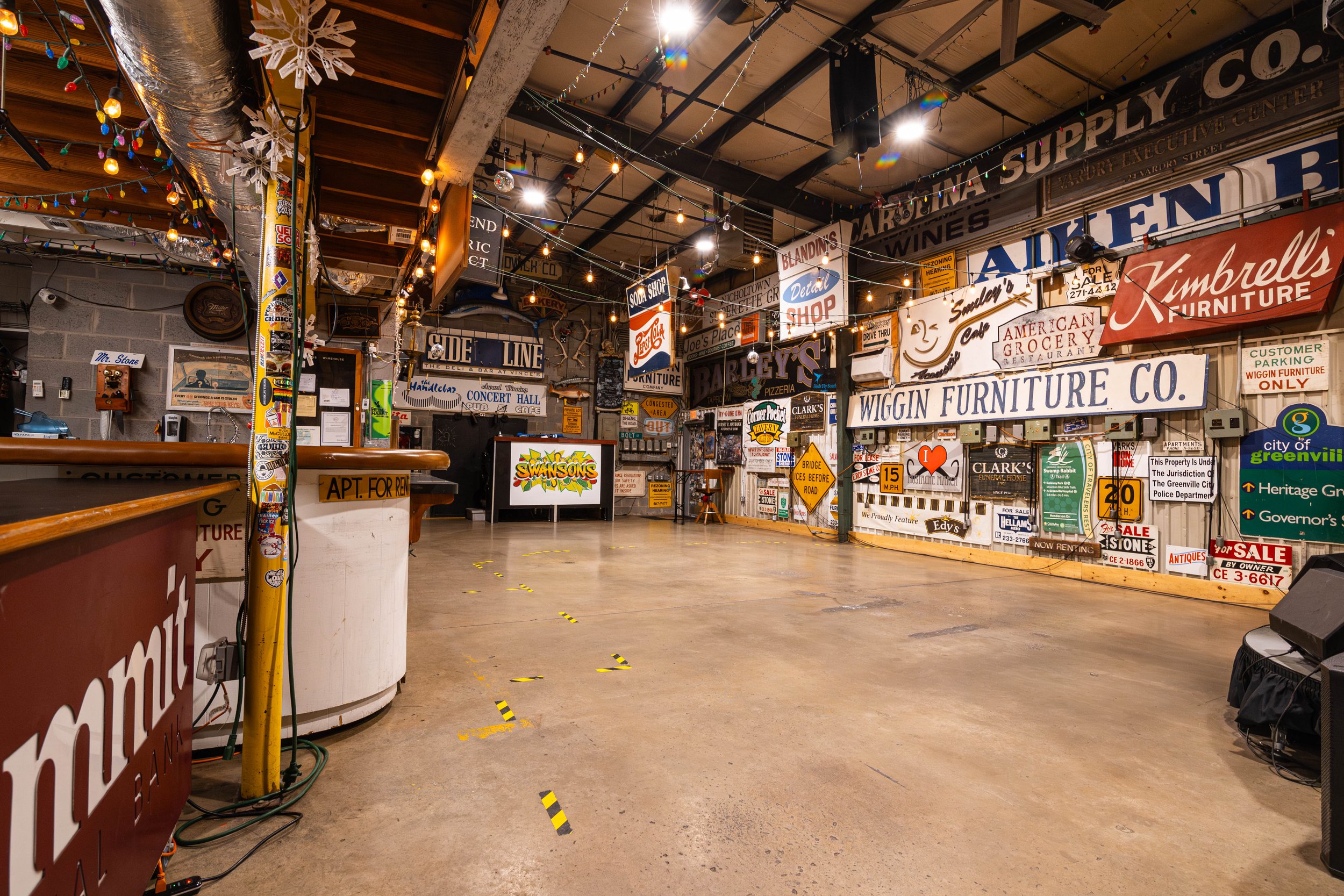 swansons-warehouse-private-event-space-greenville-sc-open-floor-vintage-signs.jpg