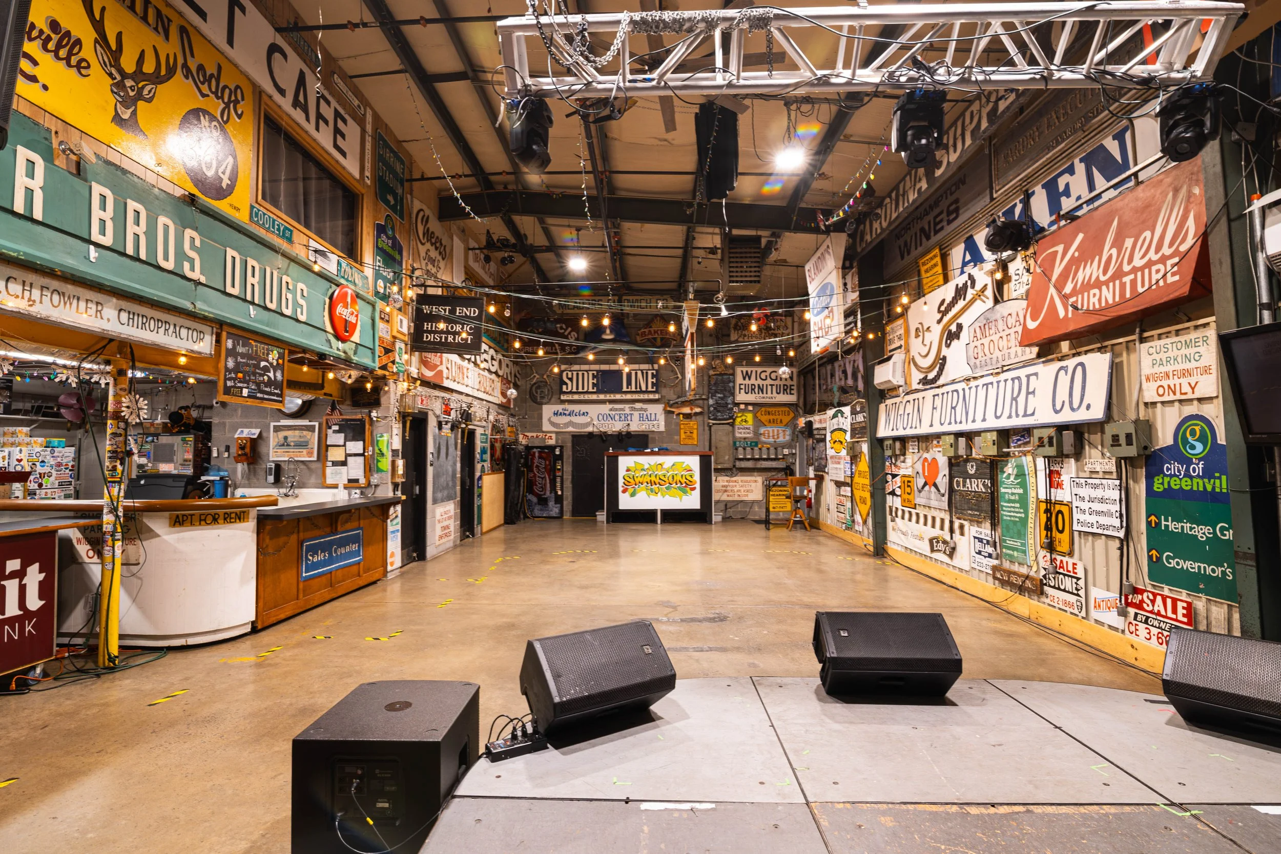 swansons-warehouse-event-space-greenville-sc-stage-view-vintage-signs.jpg