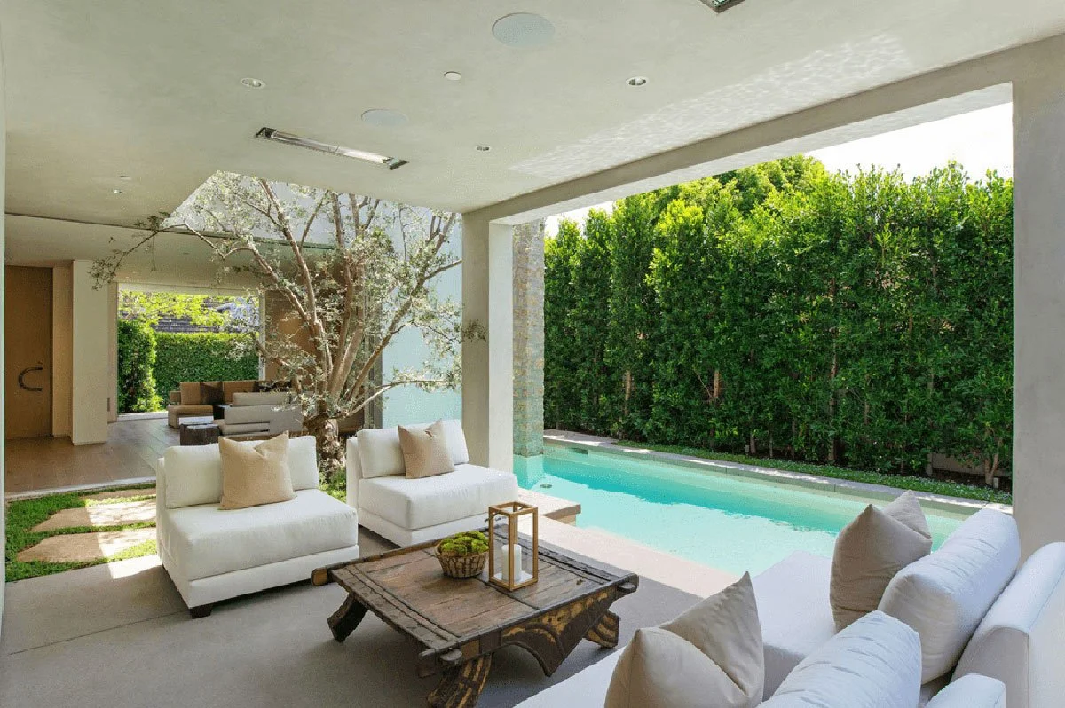 Covered outdoor lounge and pool area in West Hollywood custom home with seamless indoor-outdoor living.