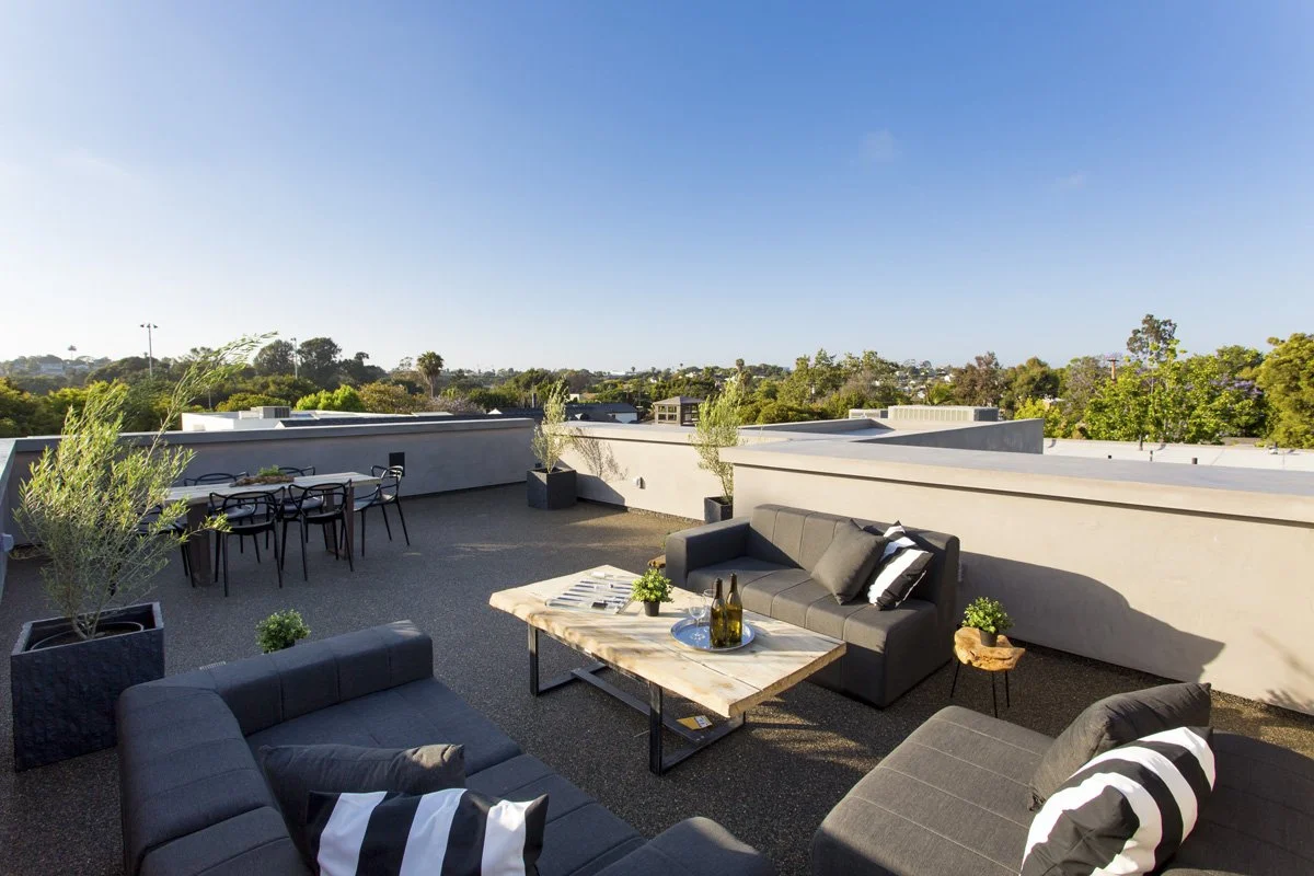 Rooftop terrace with outdoor lounge seating on modern Venice residence