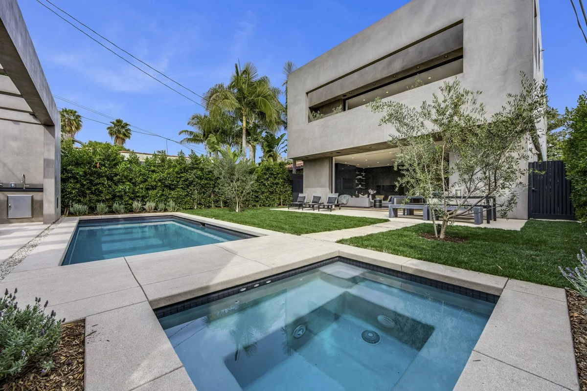 West Hollywood custom home backyard with modern pool, spa, and open indoor-outdoor living design