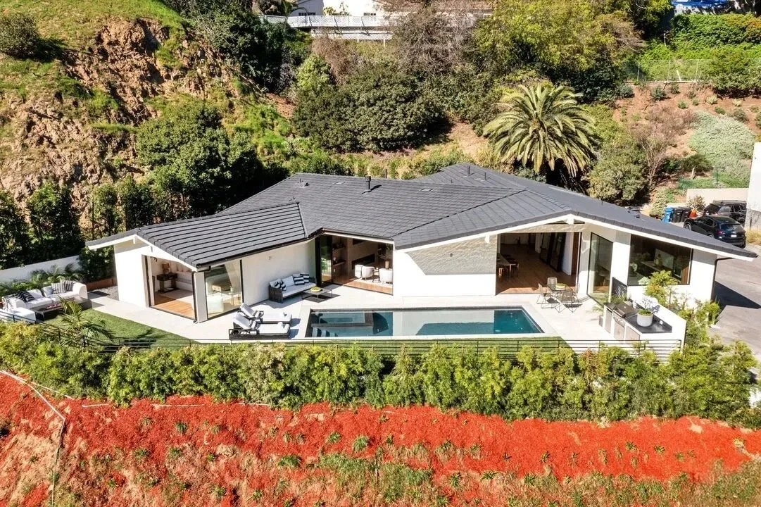 Modern Hollywood Hills custom home built on a sloped hillside lot with pool and indoor-outdoor living design