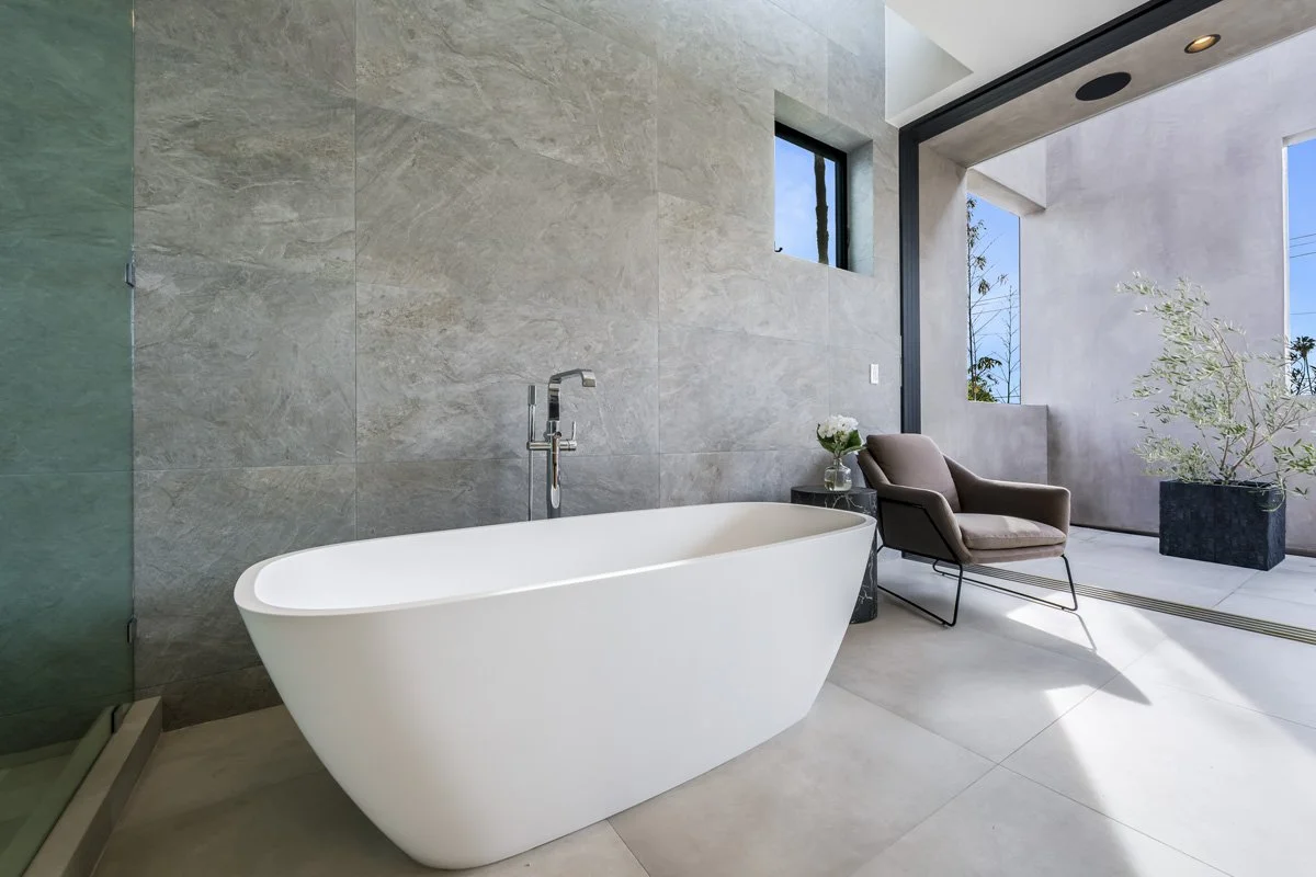 Modern West Hollywood luxury bathroom with freestanding tub and indoor outdoor terrace