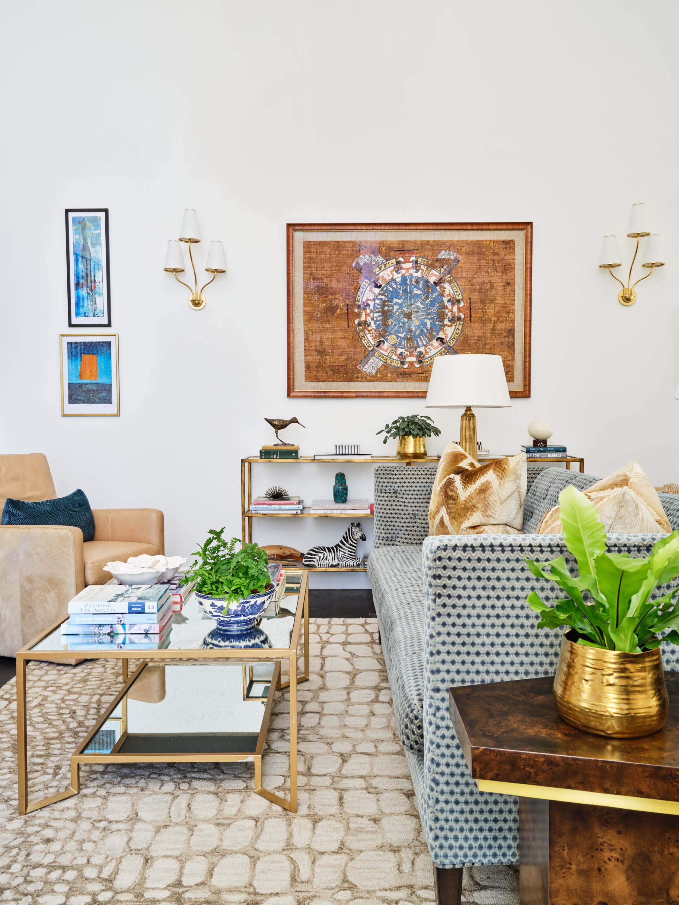 Malibu custom home living room with layered seating, brass accents, curated artwork, and refined interior finishes by Heart Construction