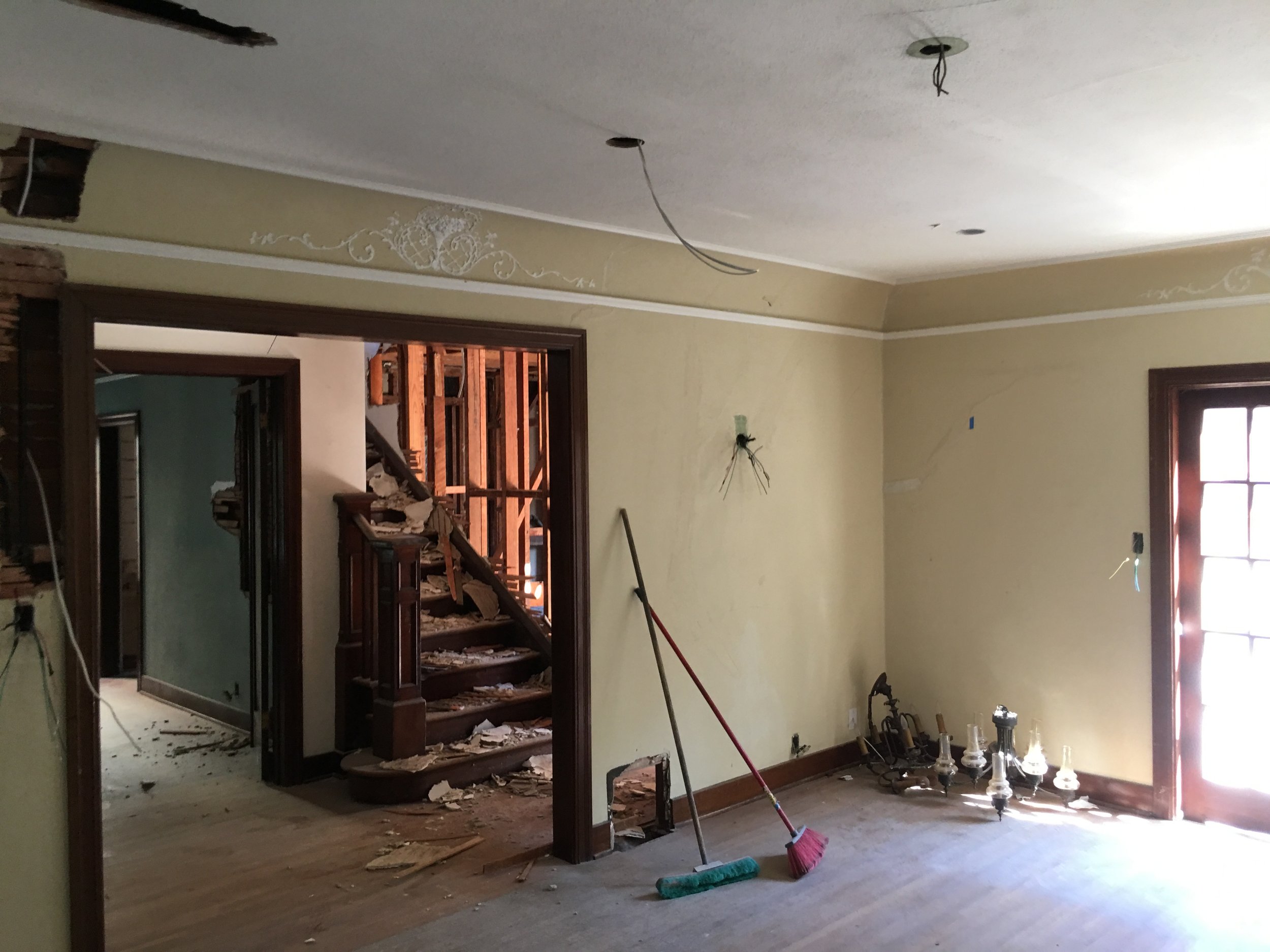 Hancock Park home before renovation interior showing demolition, exposed framing, and original compartmentalized layout