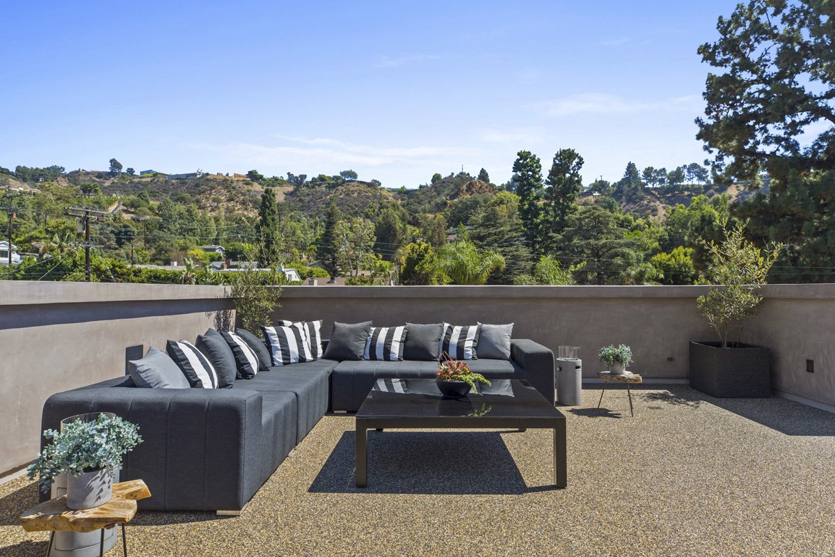 Beverly Hills rooftop lounge with sectional seating and panoramic canyon views