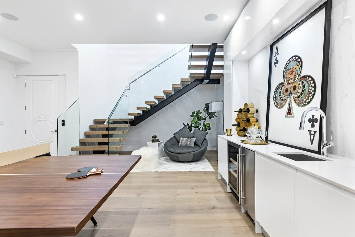 Beverly Hills floating staircase with wood treads, black steel stringer, and glass railing detail