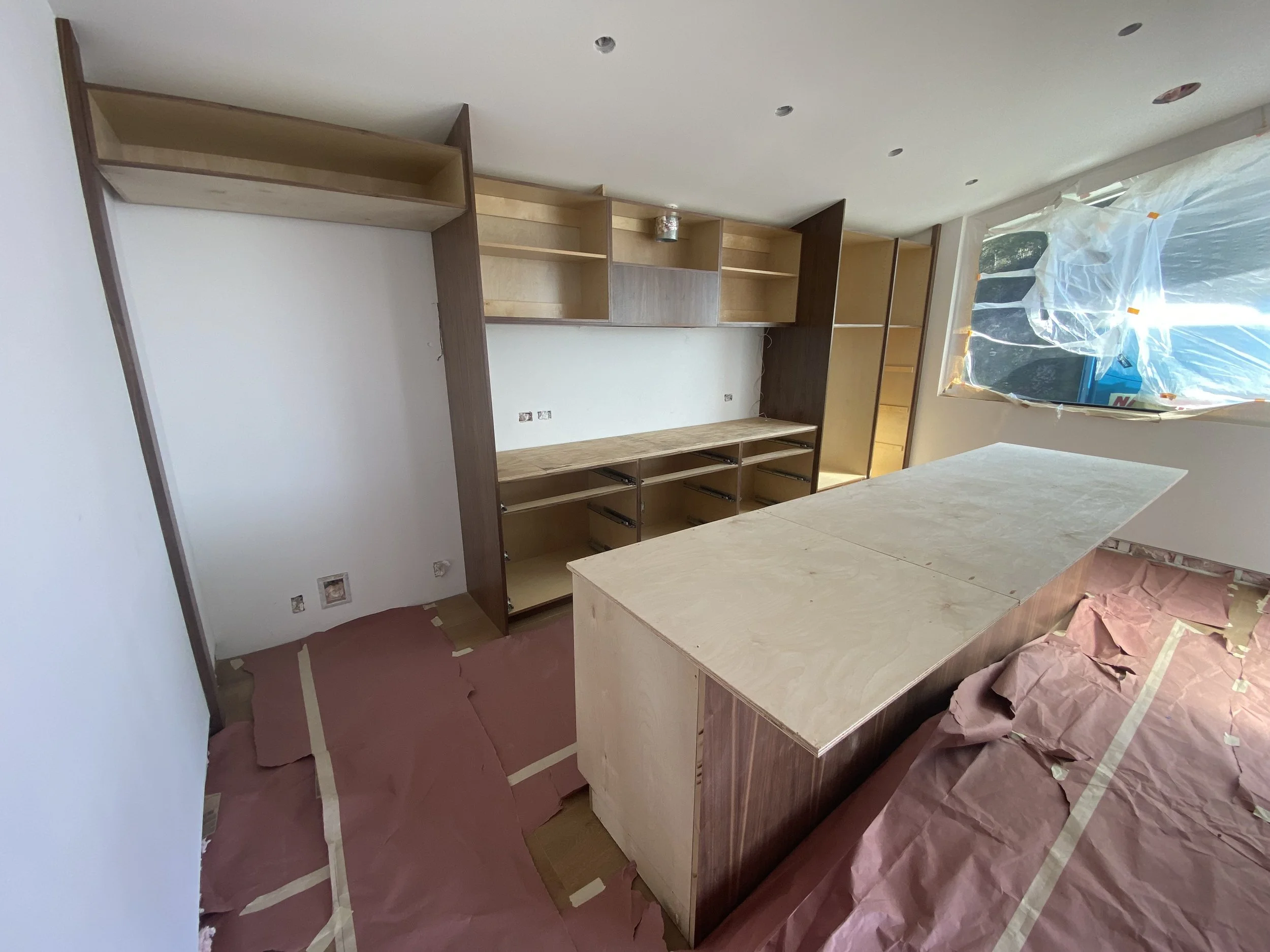 Hollywood Hills home remodel during construction with exposed framing, structural beam installation, and open floor plan reconfiguration