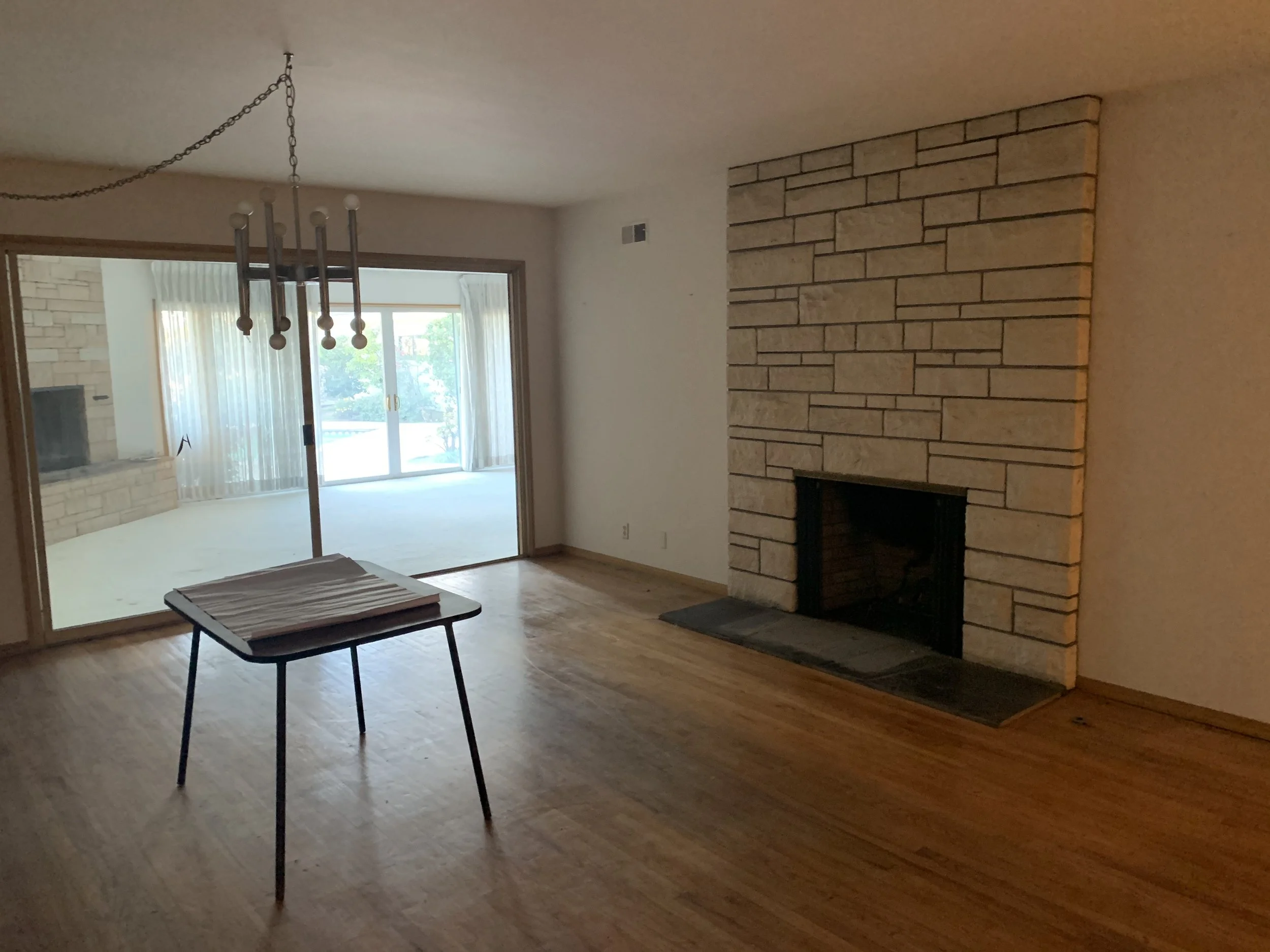 Culver City interior before remodel showing segmented rooms, sliding doors between spaces, and limited natural flow