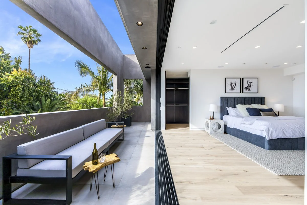 West Hollywood primary bedroom with sliding glass doors and private terrace
