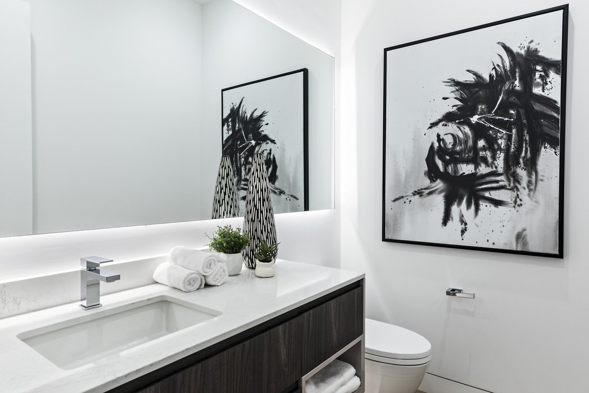 Beverly Hills powder room with floating vanity, quartz countertop, and abstract artwork