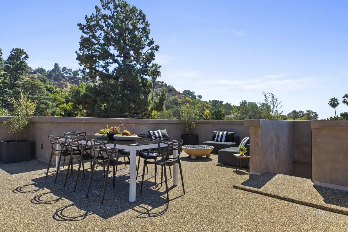 Beverly Hills rooftop terrace dining area with hillside views and contemporary outdoor furniture