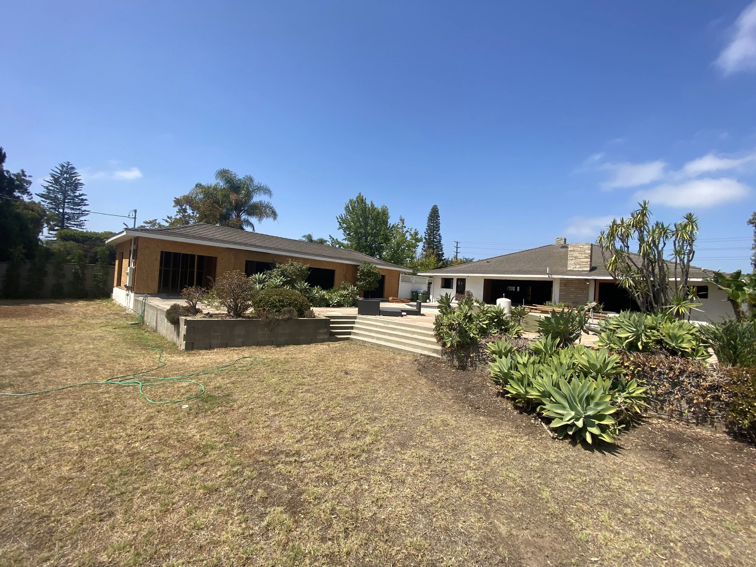 Culver City remodel in progress showing main house and new ADU structure under construction with updated backyard layout and exterior reconfiguration