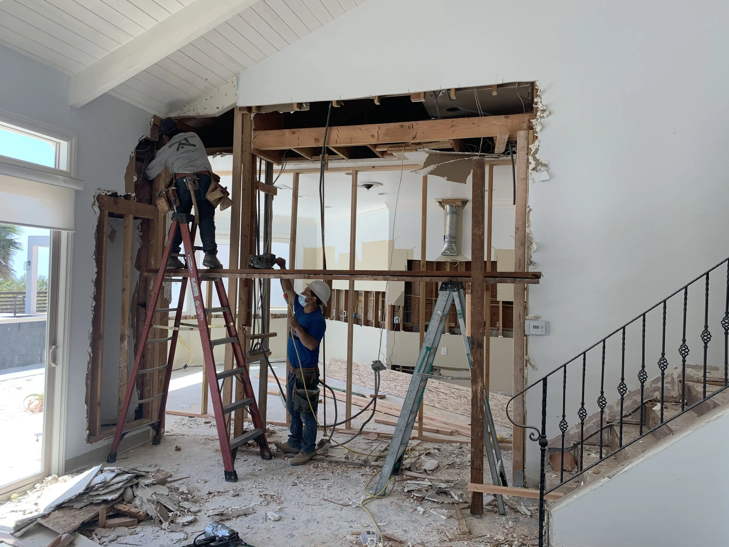 During remodel removal of load-bearing walls and installation of new structural framing to open main living space